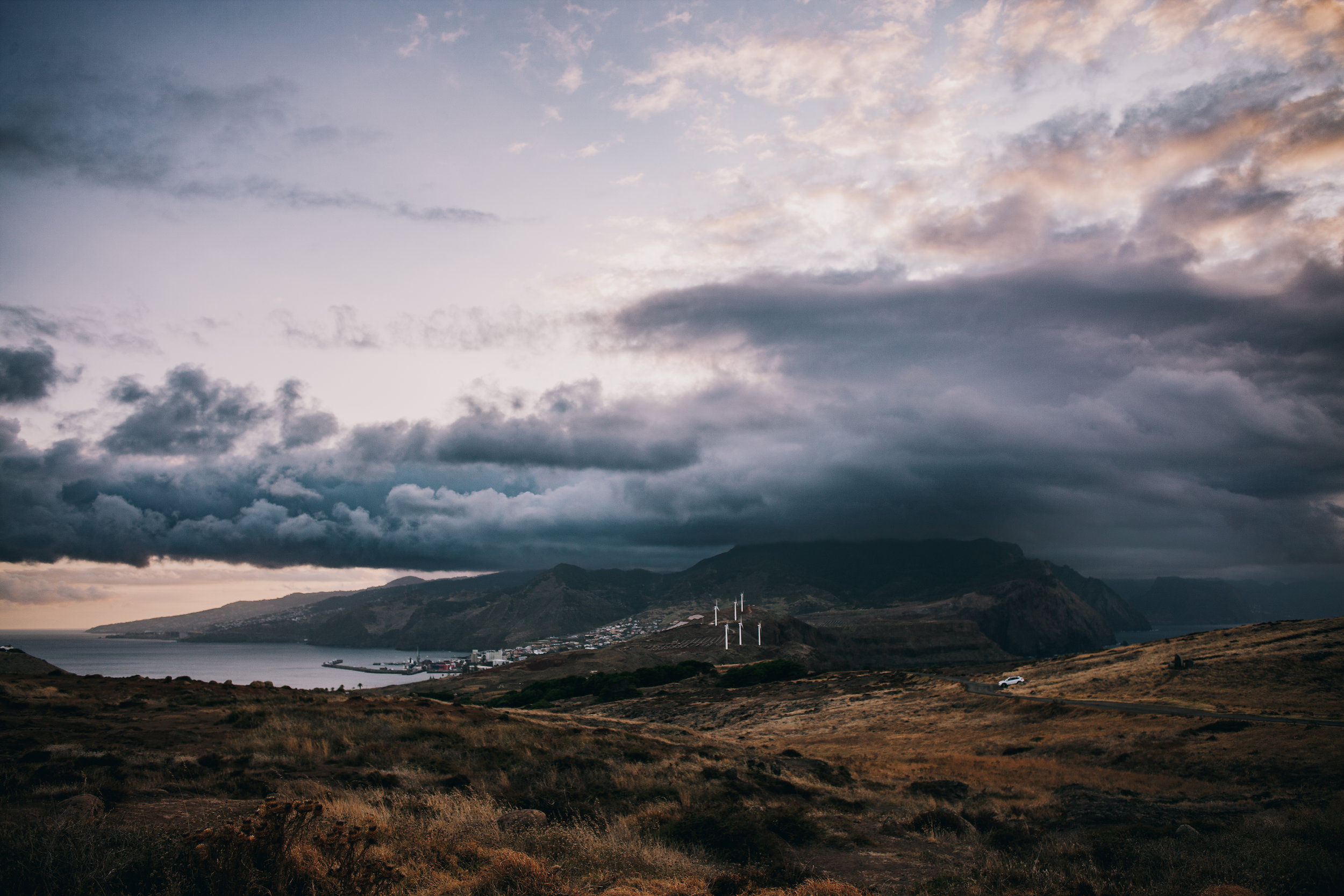 Storm cloud over Machico bay, seen west from the dry slopes of Ponta de São Lourenço, Madeira
