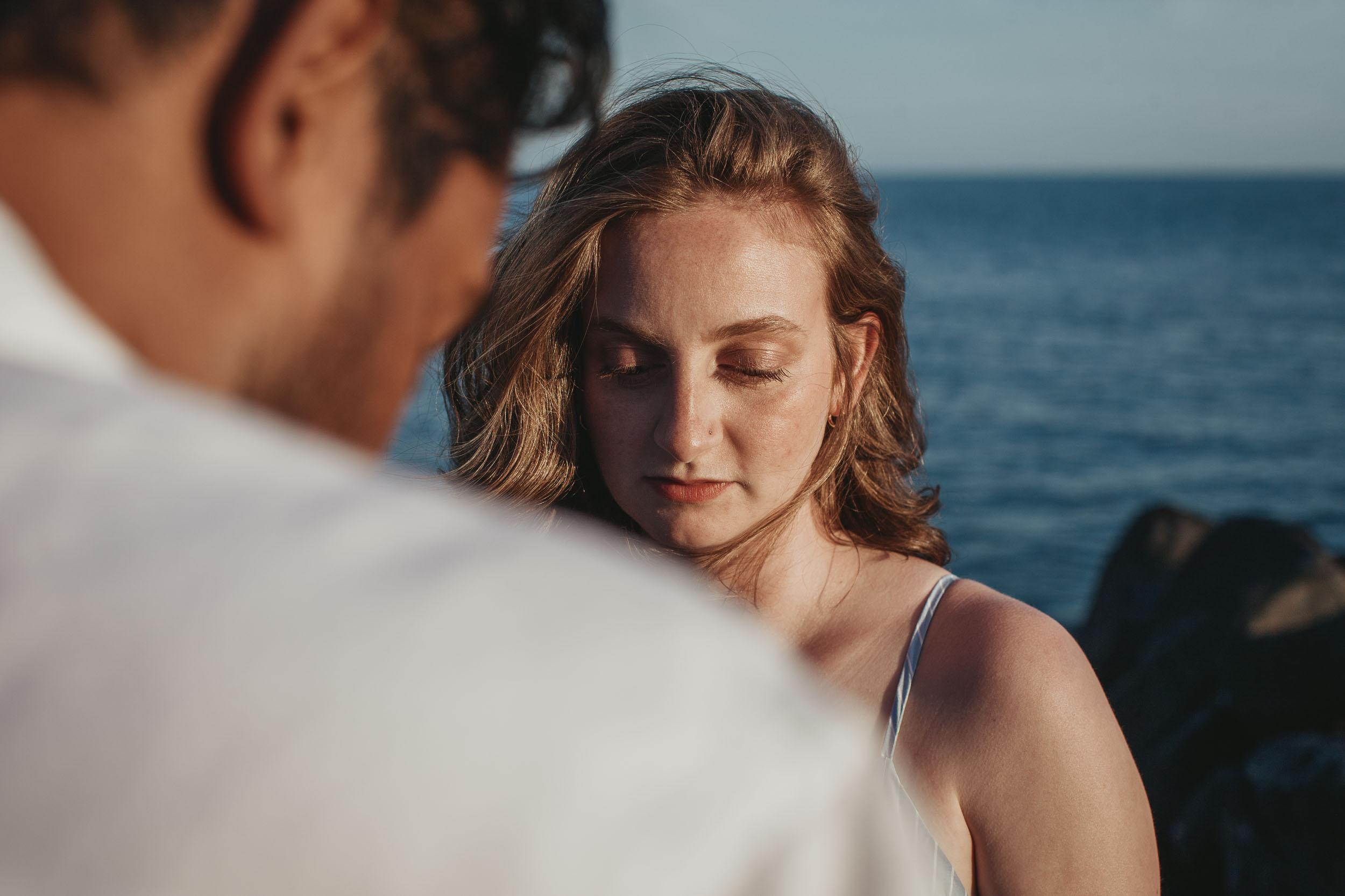Couple embracing at Praia Formosa, Madeira