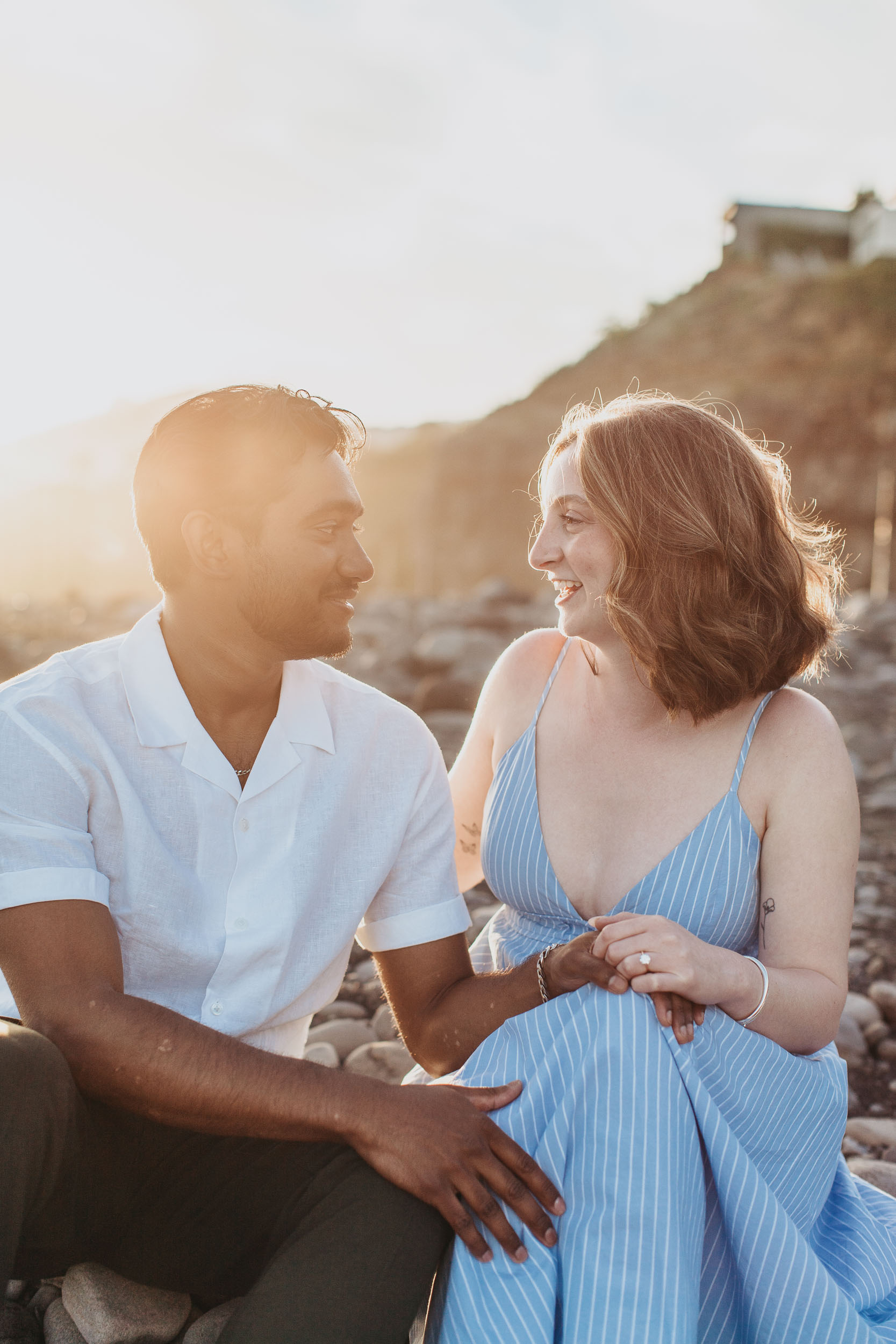 Couple kissing at Praia Formosa, Funchal, Madeira