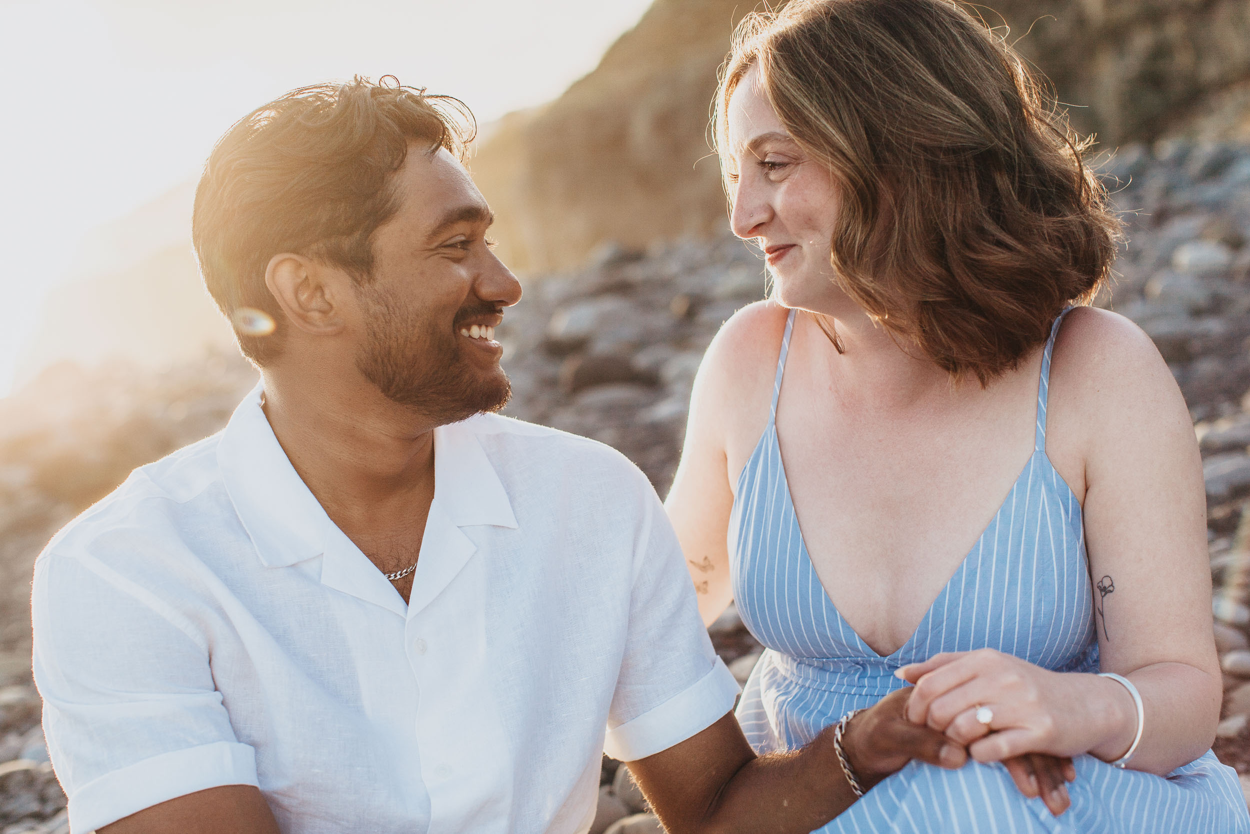 Woman with engagement ring at Praia Formosa beach, Madeira