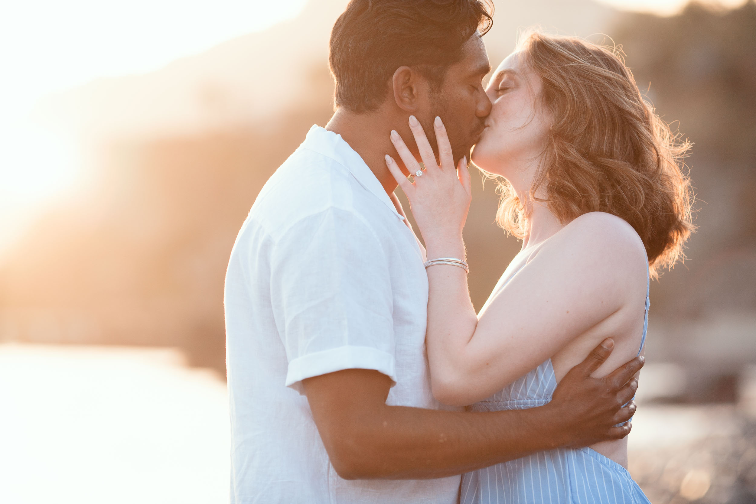 Couple at Praia Formosa beach at sunset, Funchal, Madeira