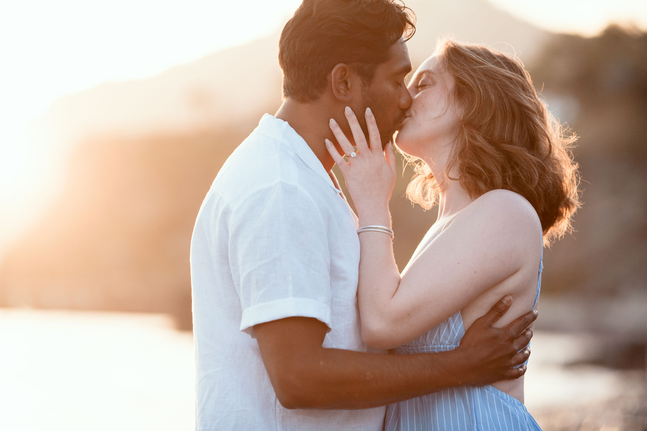 Couple embracing at Praia Formosa, Madeira