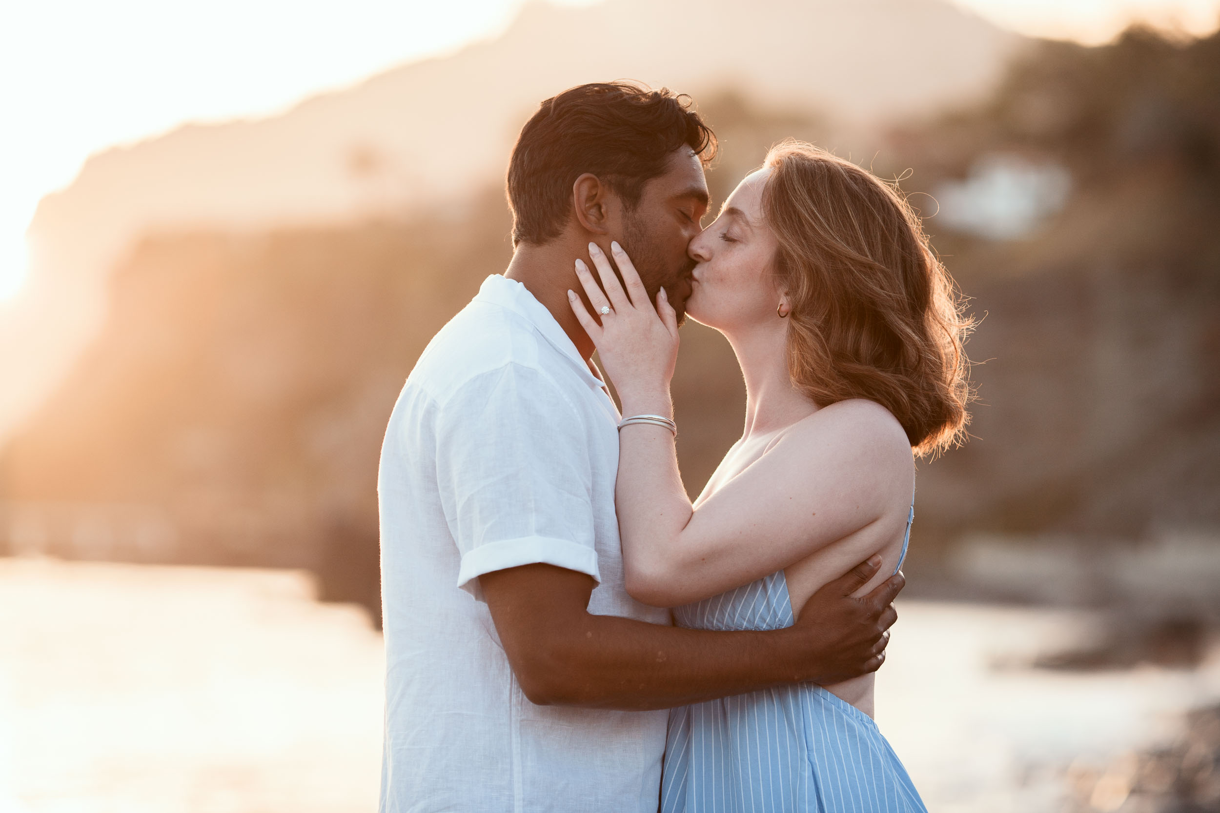 Couple holding hands at Atlantic shore, Praia Formosa, Madeira