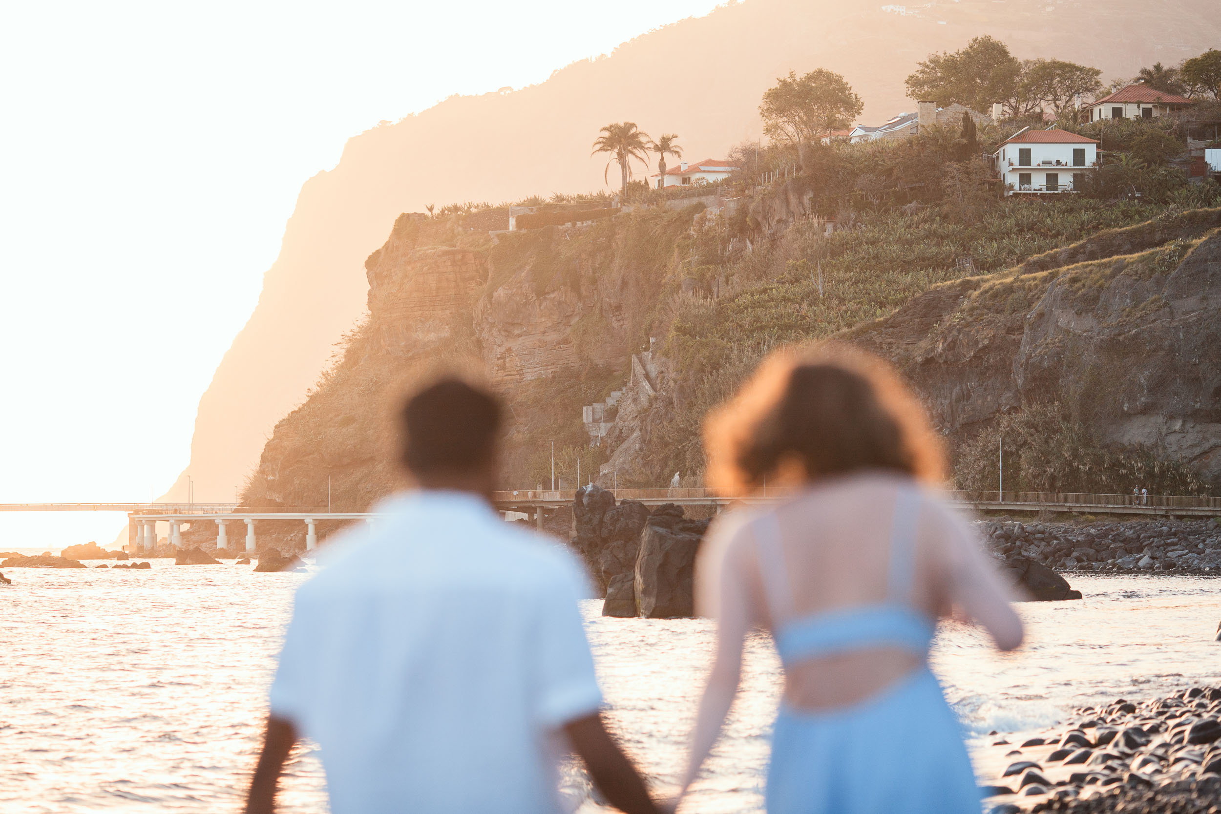 Couple on Praia Formosa beach at dusk, Funchal, Madeira