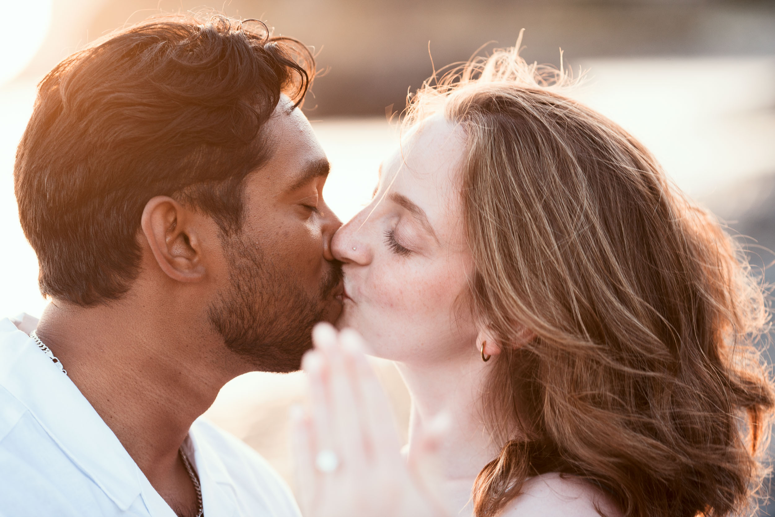 Couple at Praia Formosa beach at sunset, Funchal, Madeira