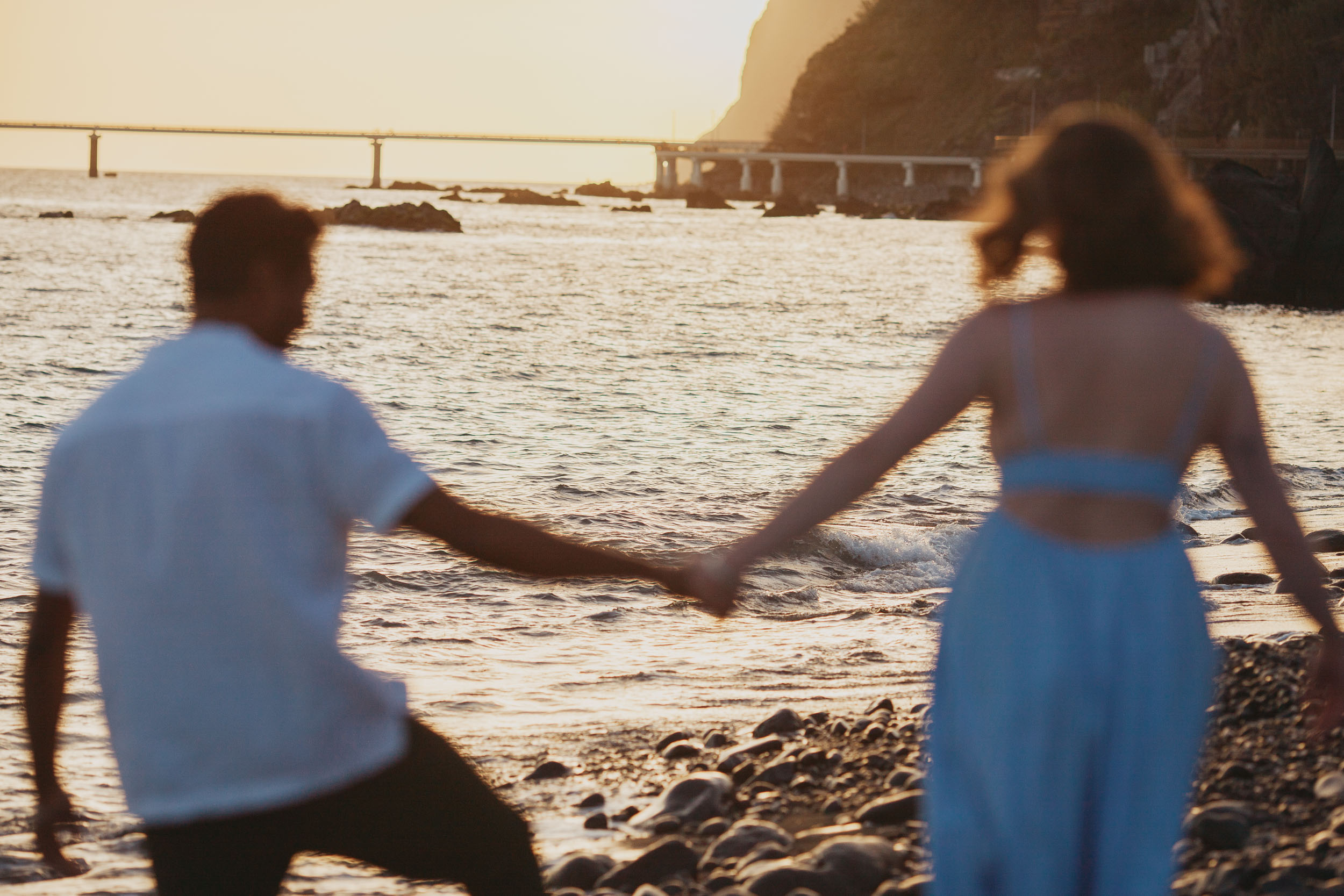 Couple embracing at Praia Formosa, Madeira