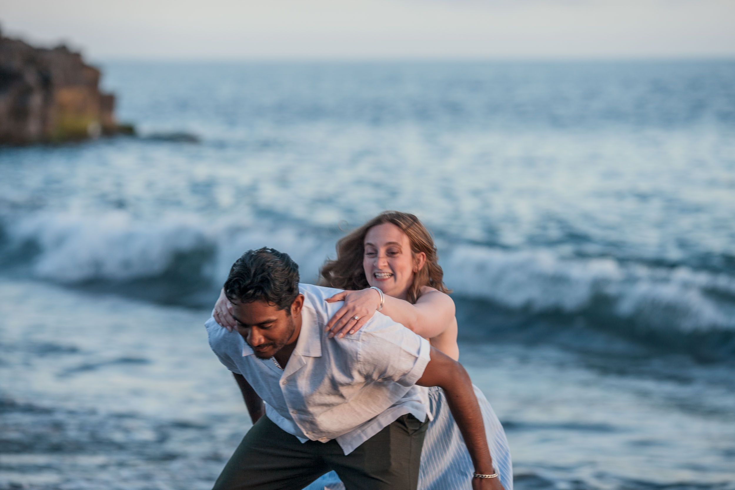 Woman with engagement ring at Praia Formosa beach, Madeira