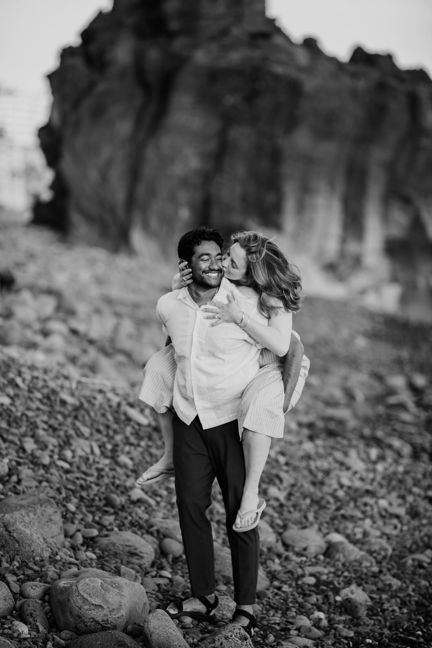 Couple embracing at Praia Formosa, Madeira