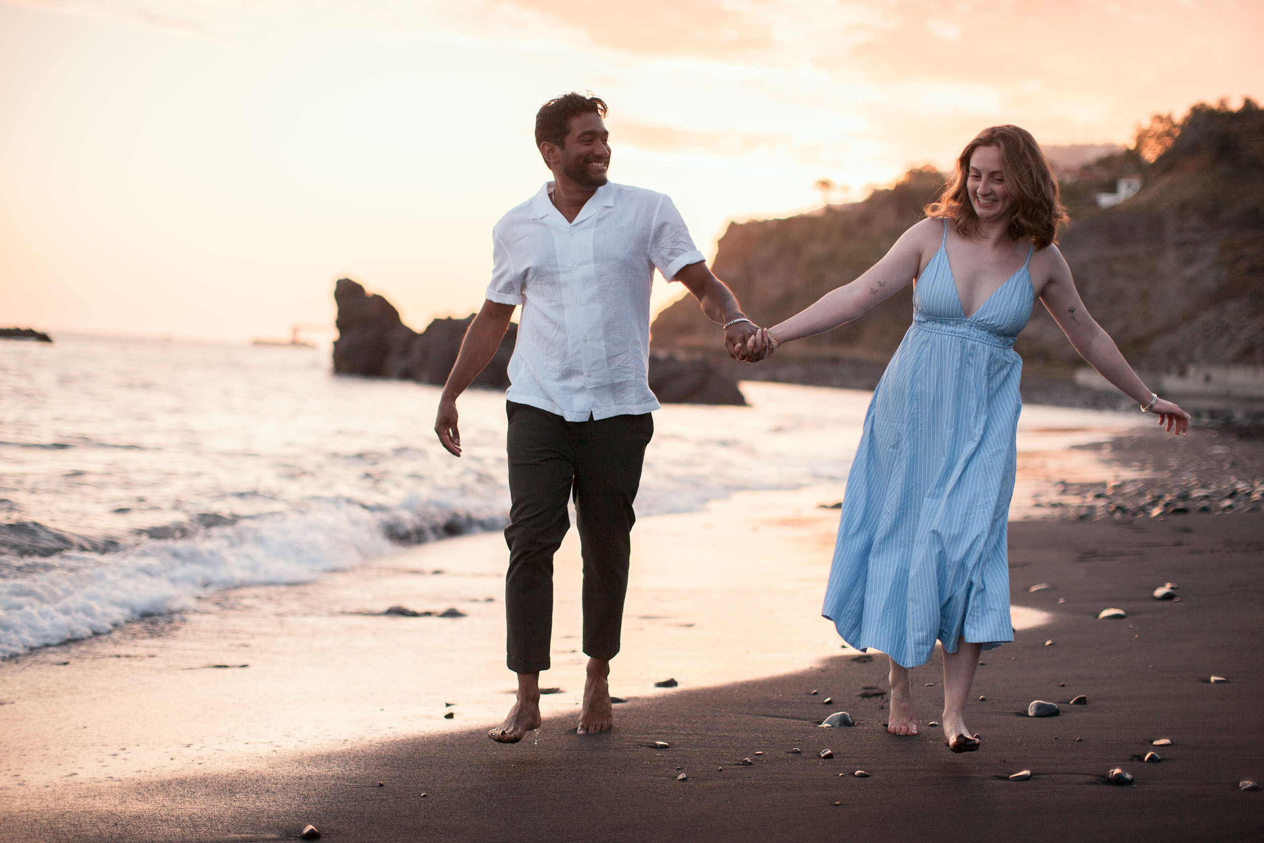 Couple kissing at Praia Formosa, Funchal, Madeira