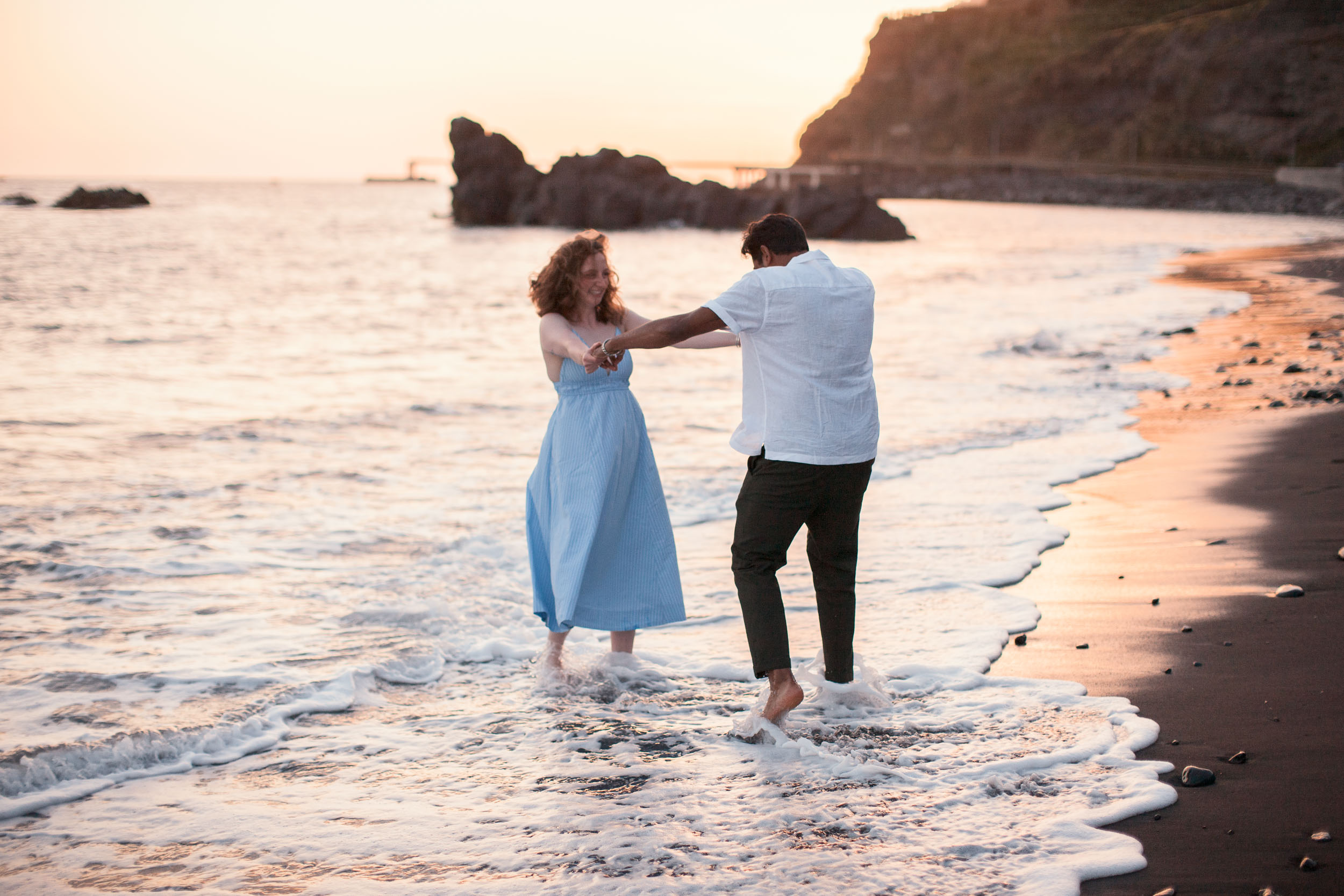 Woman with engagement ring at Praia Formosa beach, Madeira