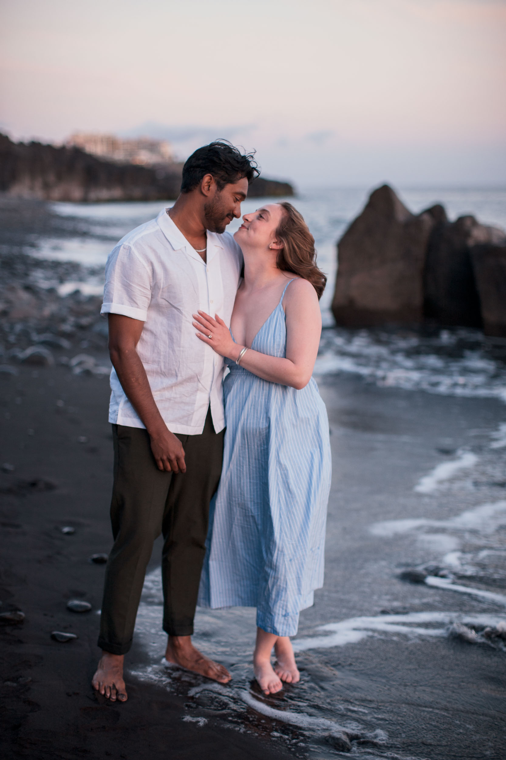 Couple kissing at Praia Formosa, Funchal, Madeira