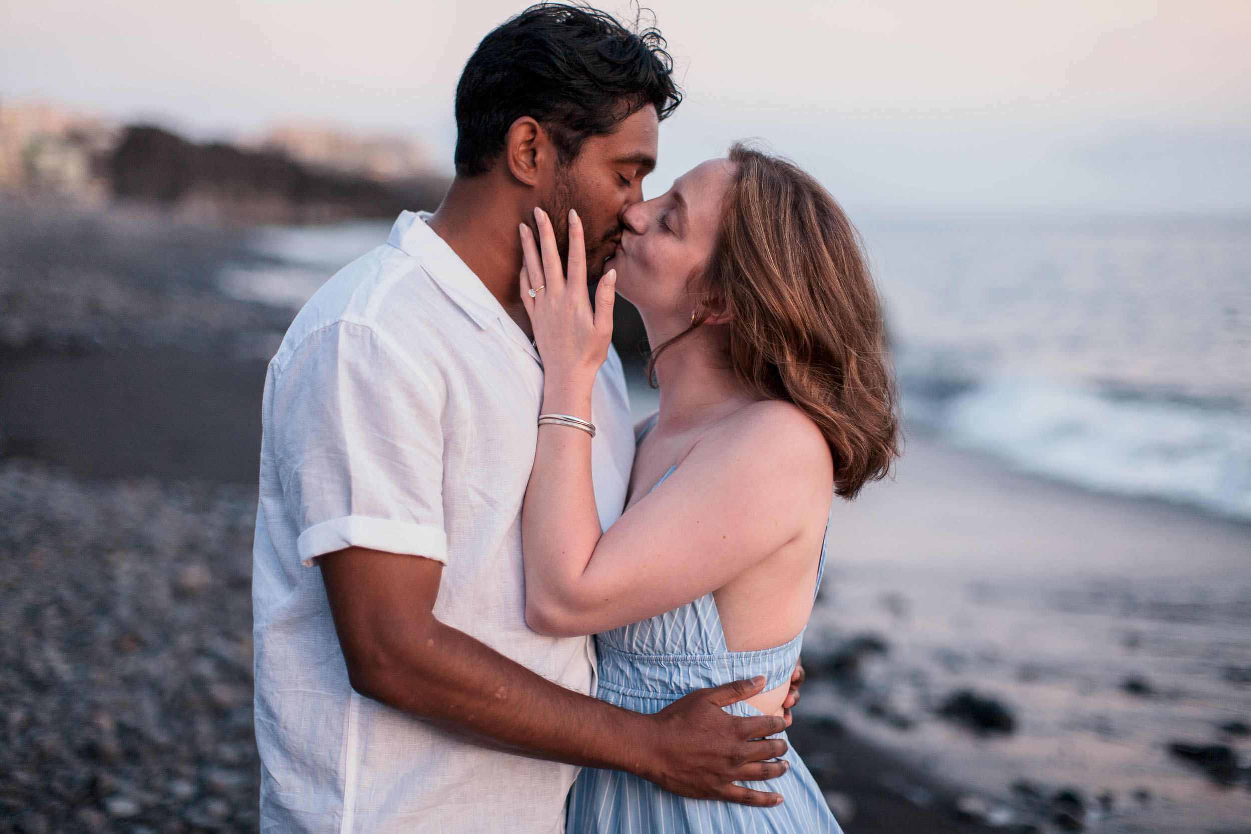 Couple at Praia Formosa beach at sunset, Funchal, Madeira