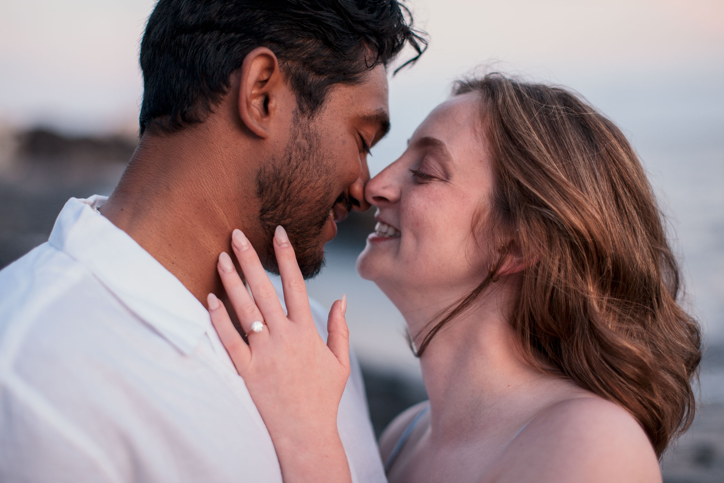Couple embracing at Praia Formosa, Madeira