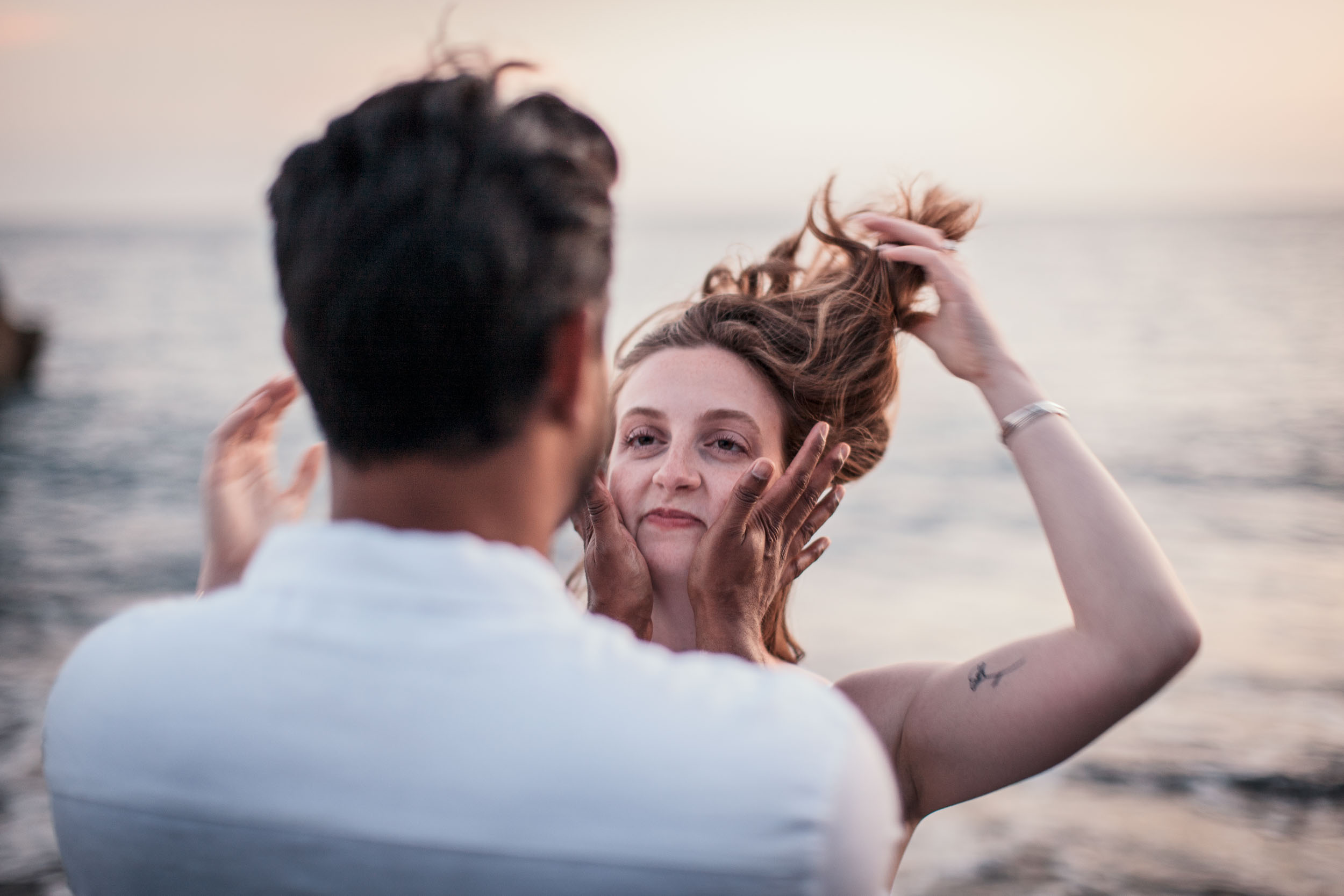 Woman with engagement ring at Praia Formosa beach, Madeira