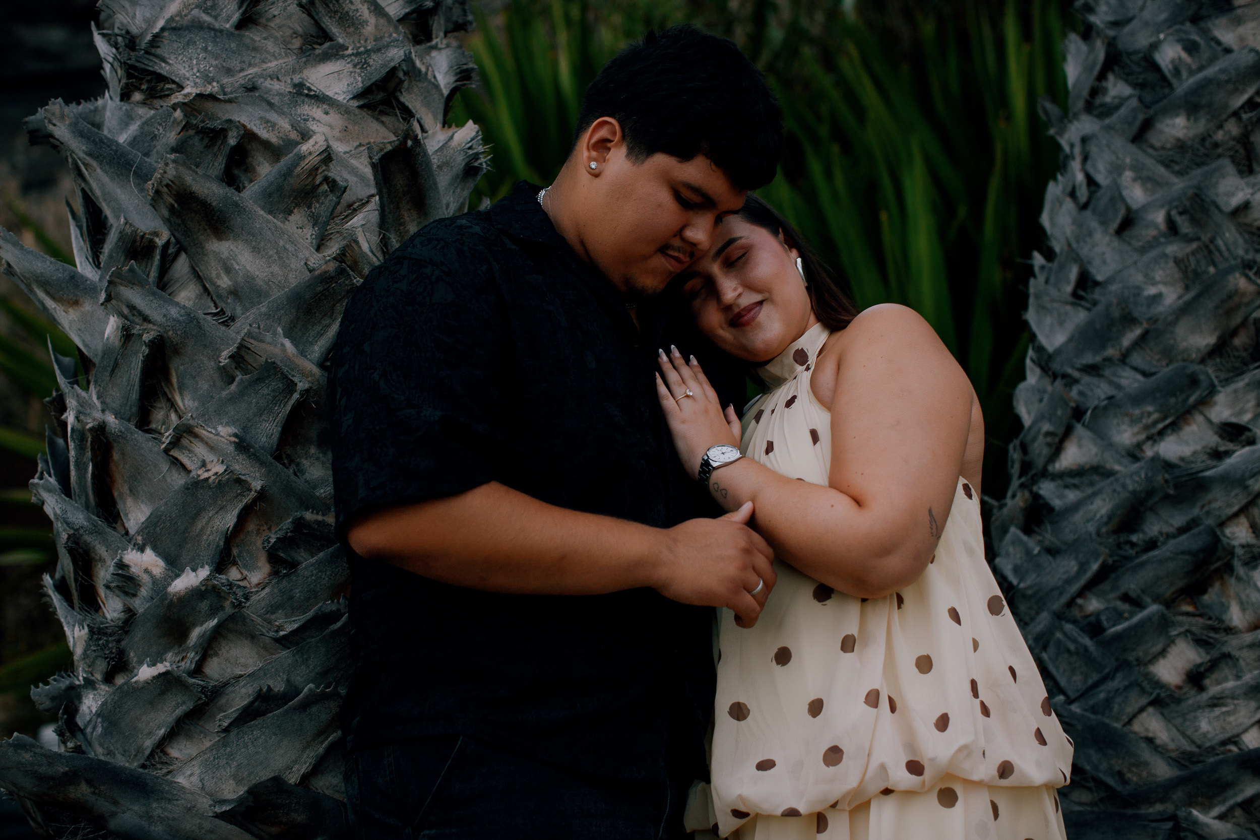 Quiet embrace by the palm trunk after the proposal, Praia Formosa, Madeira