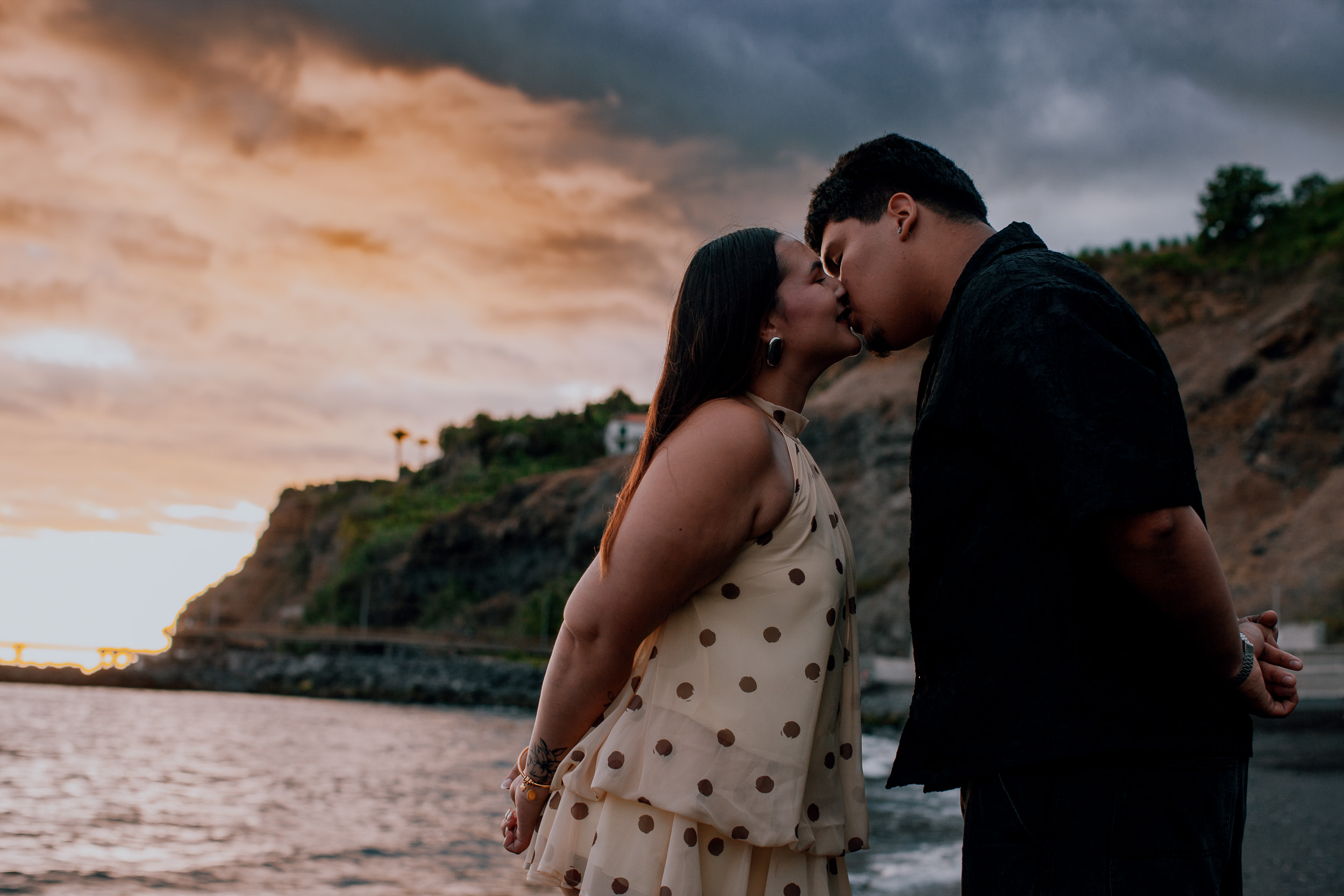 Kiss above the bay as the sunset colours the clouds, Praia Formosa, Madeira