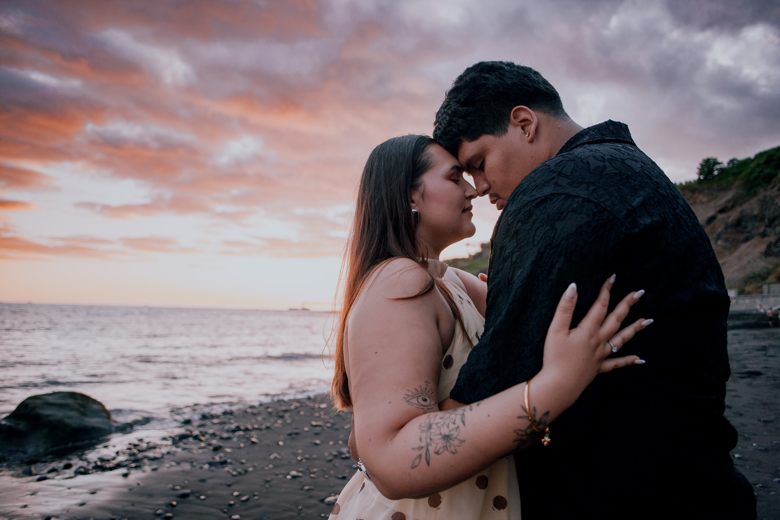 Forehead to forehead beside the cliff in the last pink light, Praia Formosa, Madeira