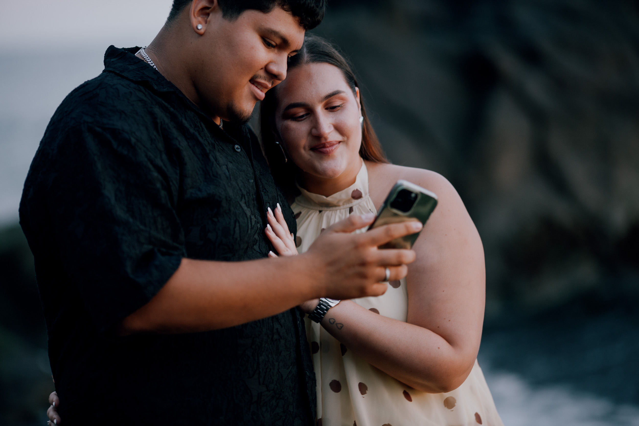 Reading messages together after announcing the engagement, Praia Formosa, Madeira