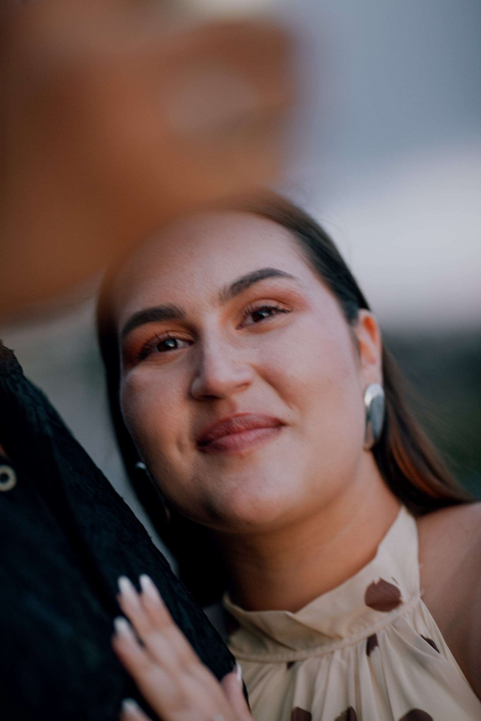 Her smile over his shoulder during the celebration call, engagement on Madeira