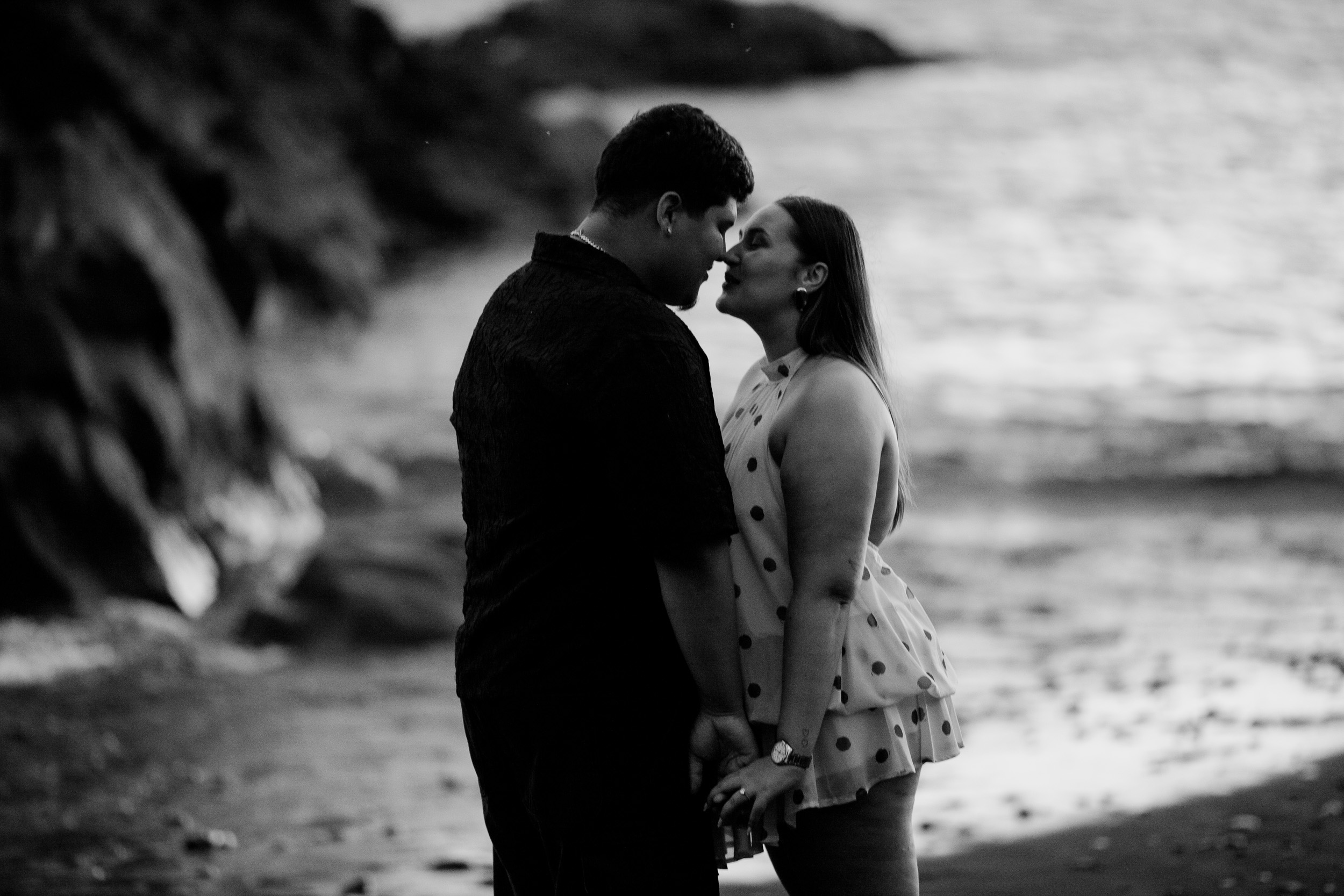 Black and white kiss by the wet rocks at nightfall, Praia Formosa, Madeira