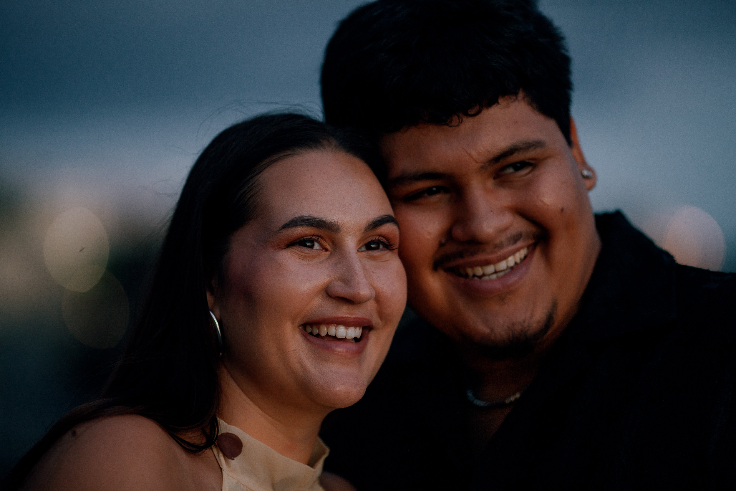 Last portrait of the night, both smiling into the camera, Praia Formosa, Madeira