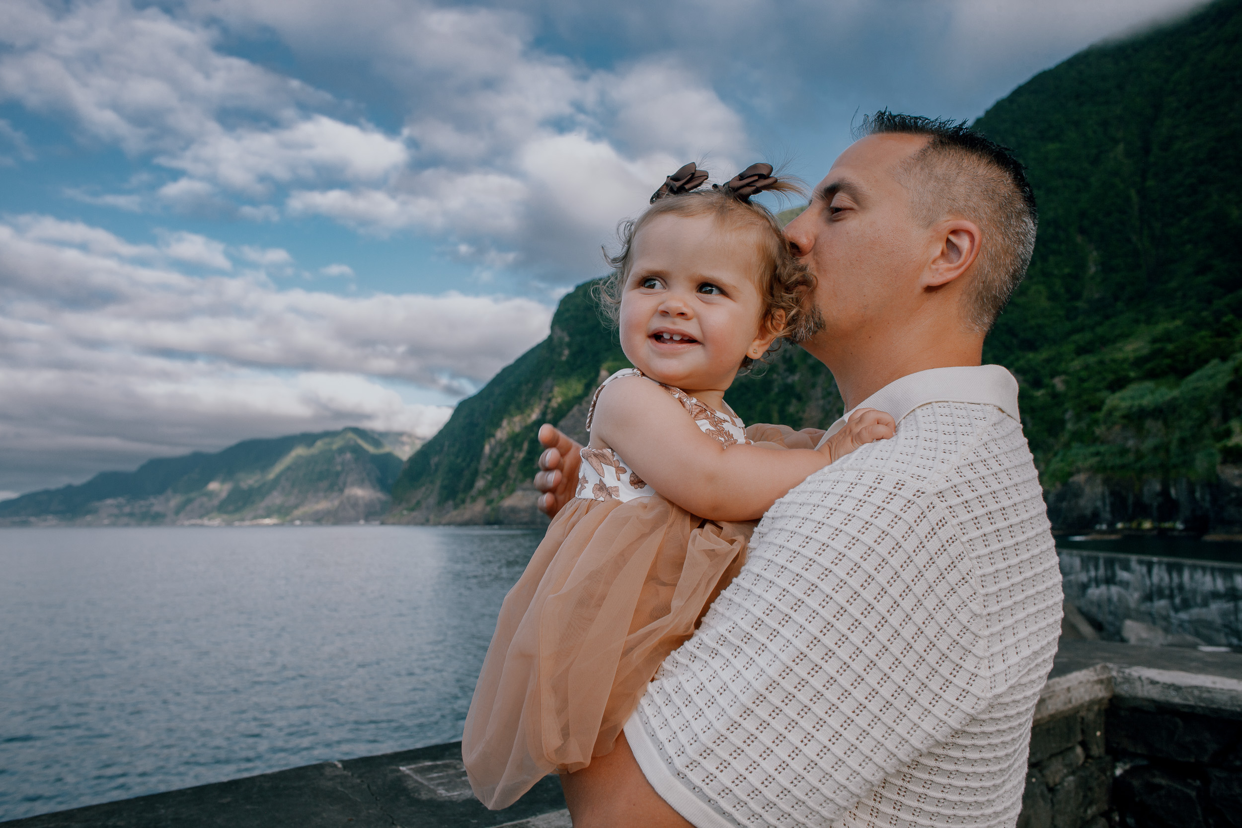 Dad kissing his baby daughter in her tulle dress, Seixal, Madeira