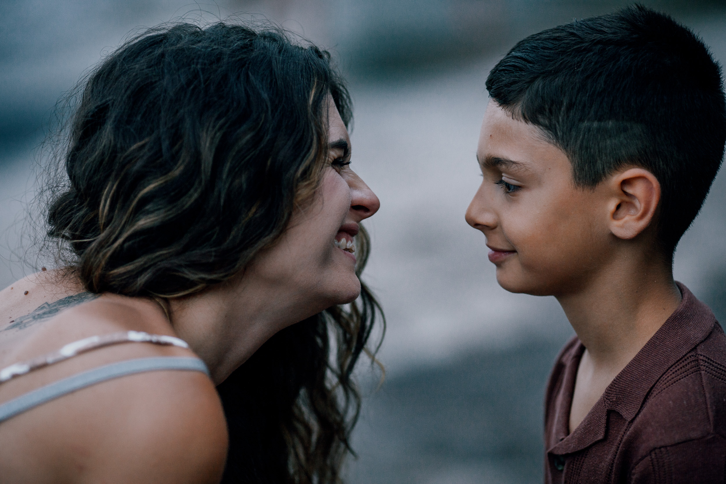 Mother and son nose to nose smiling, Seixal, Madeira