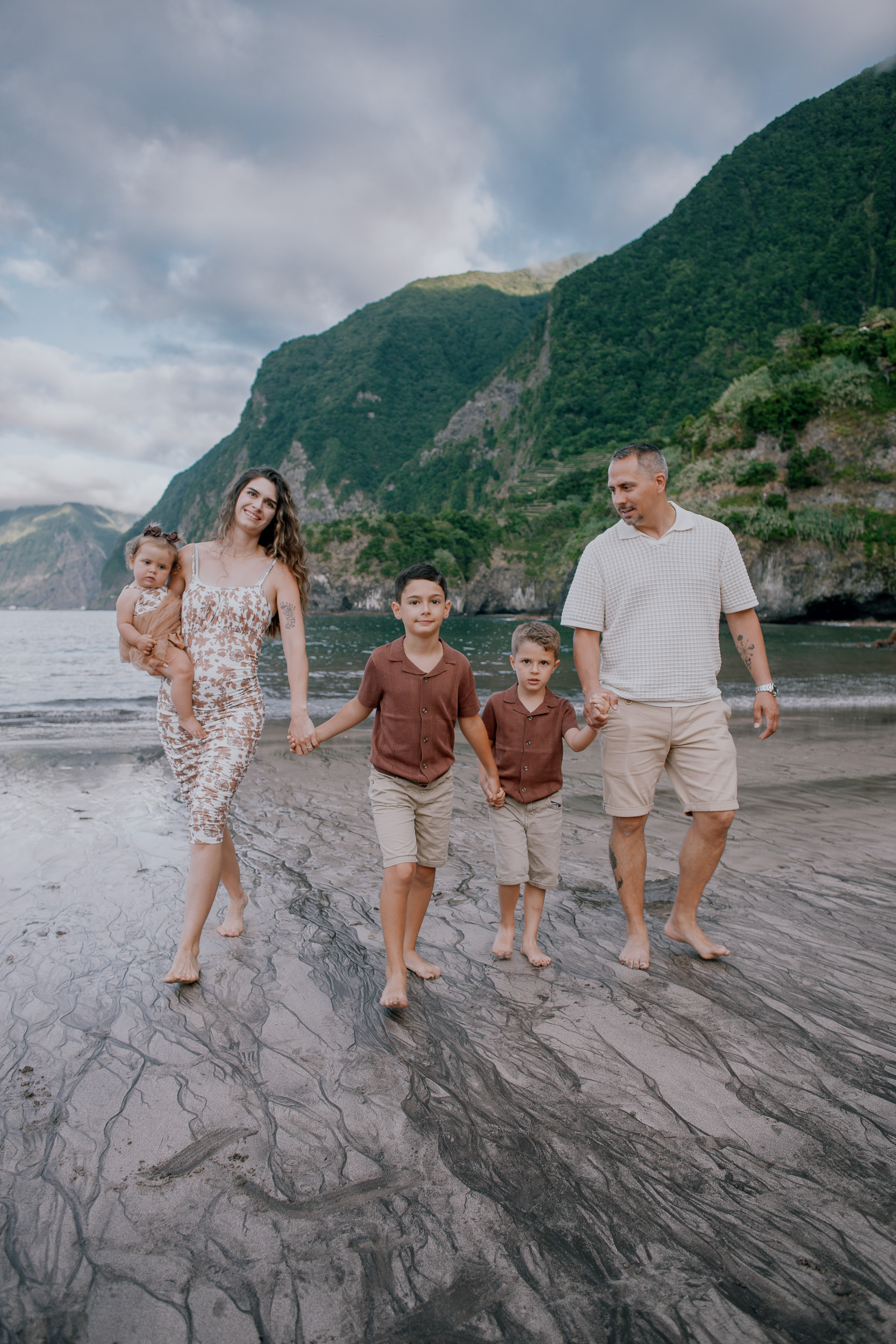 Mother with the baby and the boys walking the shore, Seixal, Madeira