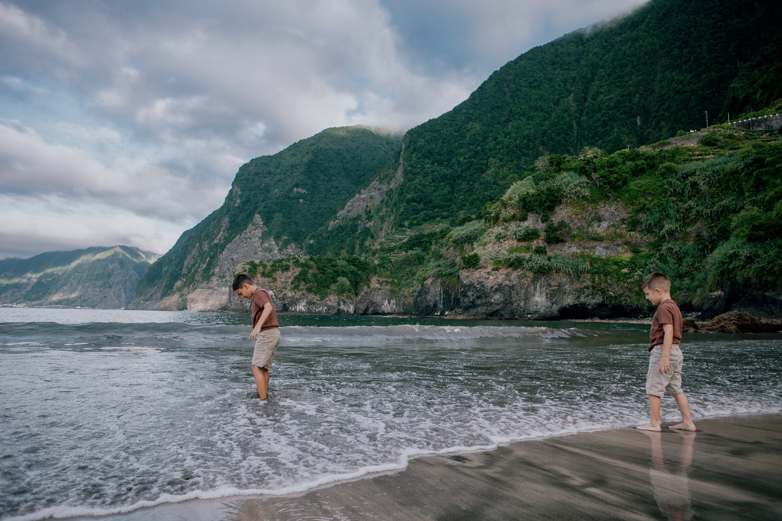 Brothers at the waterline under the north coast cliffs, Seixal, Madeira