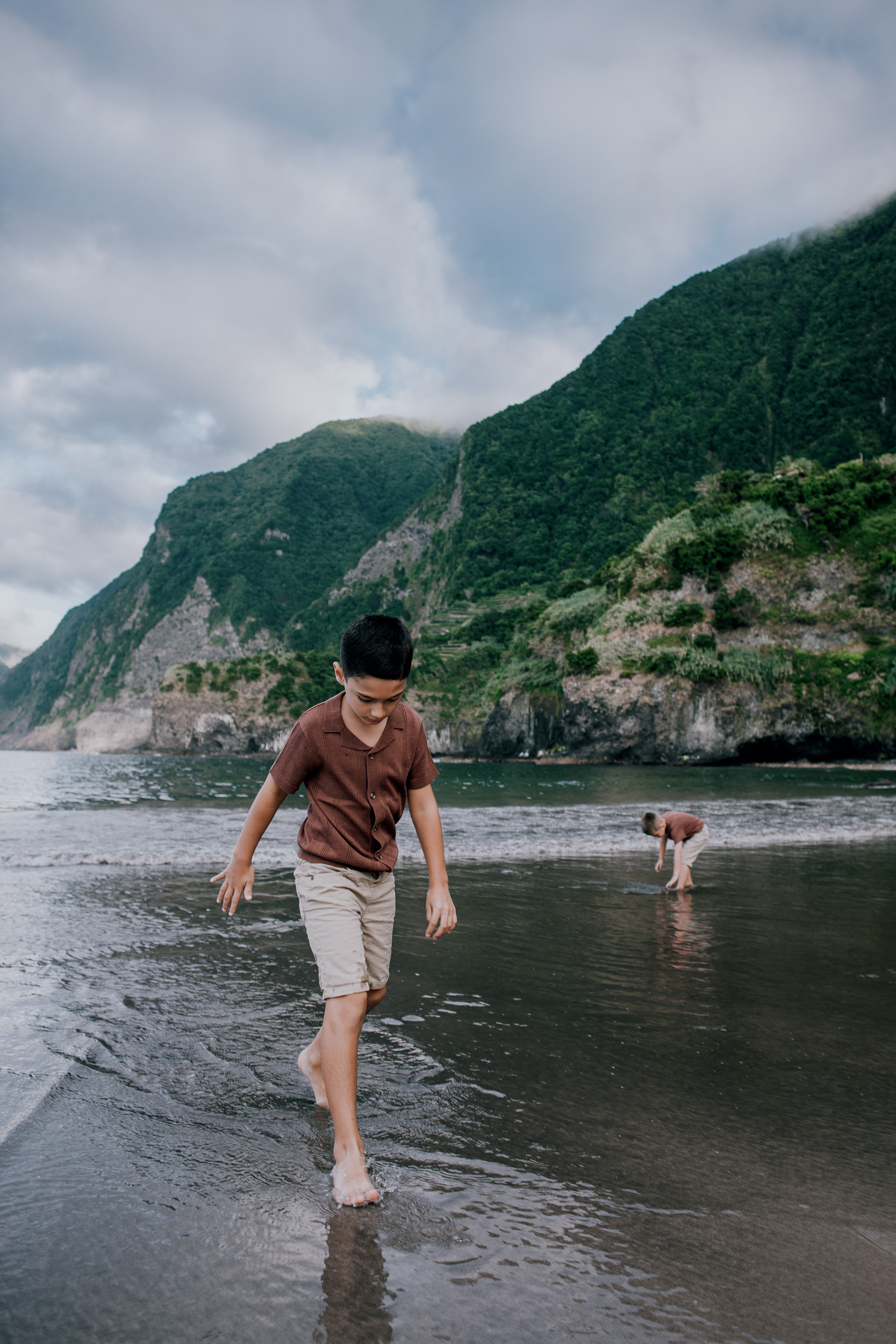 The older boy at the surf, brother in the distance, Seixal, Madeira