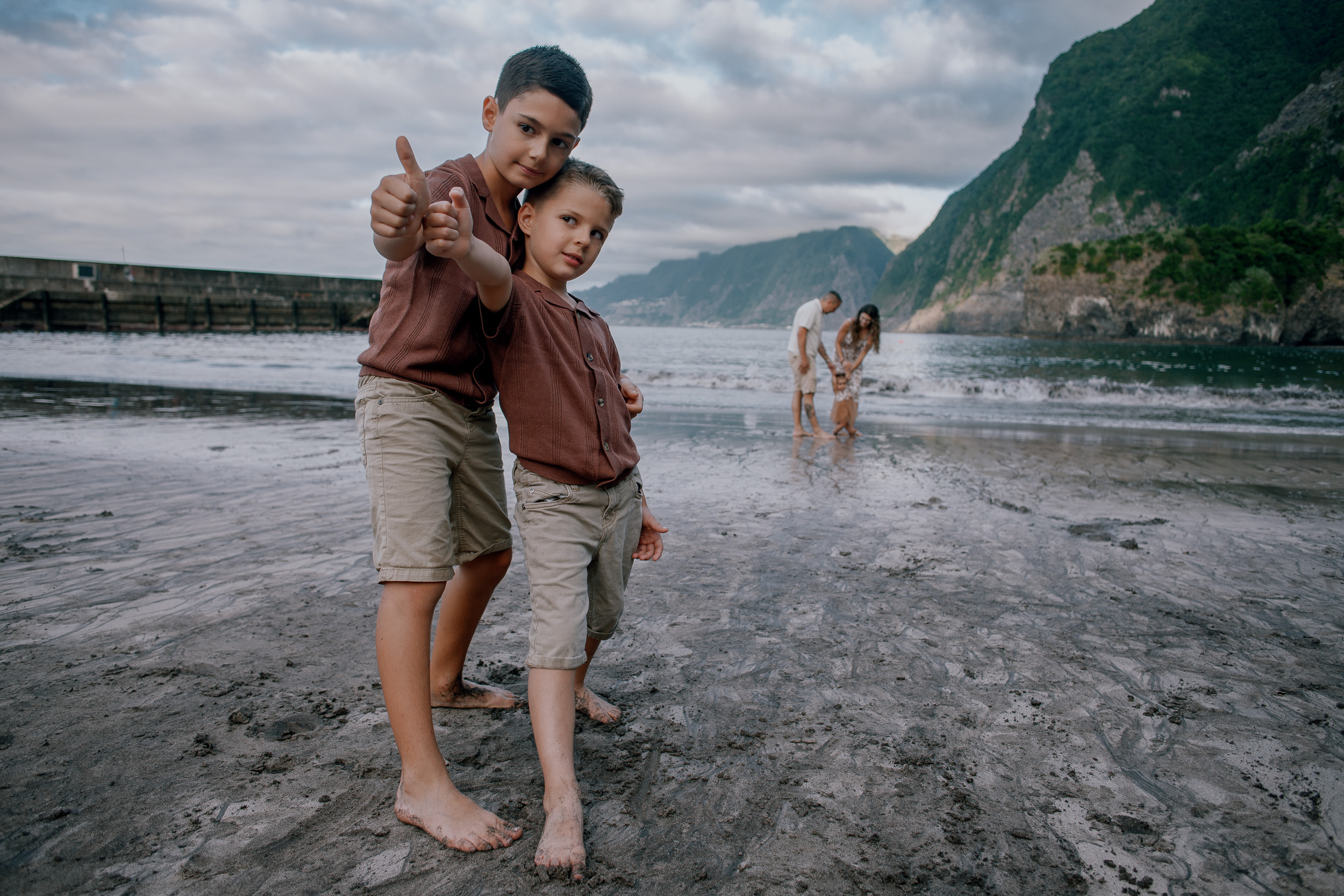 The younger boy puffing his cheeks with thumbs up, Seixal, Madeira