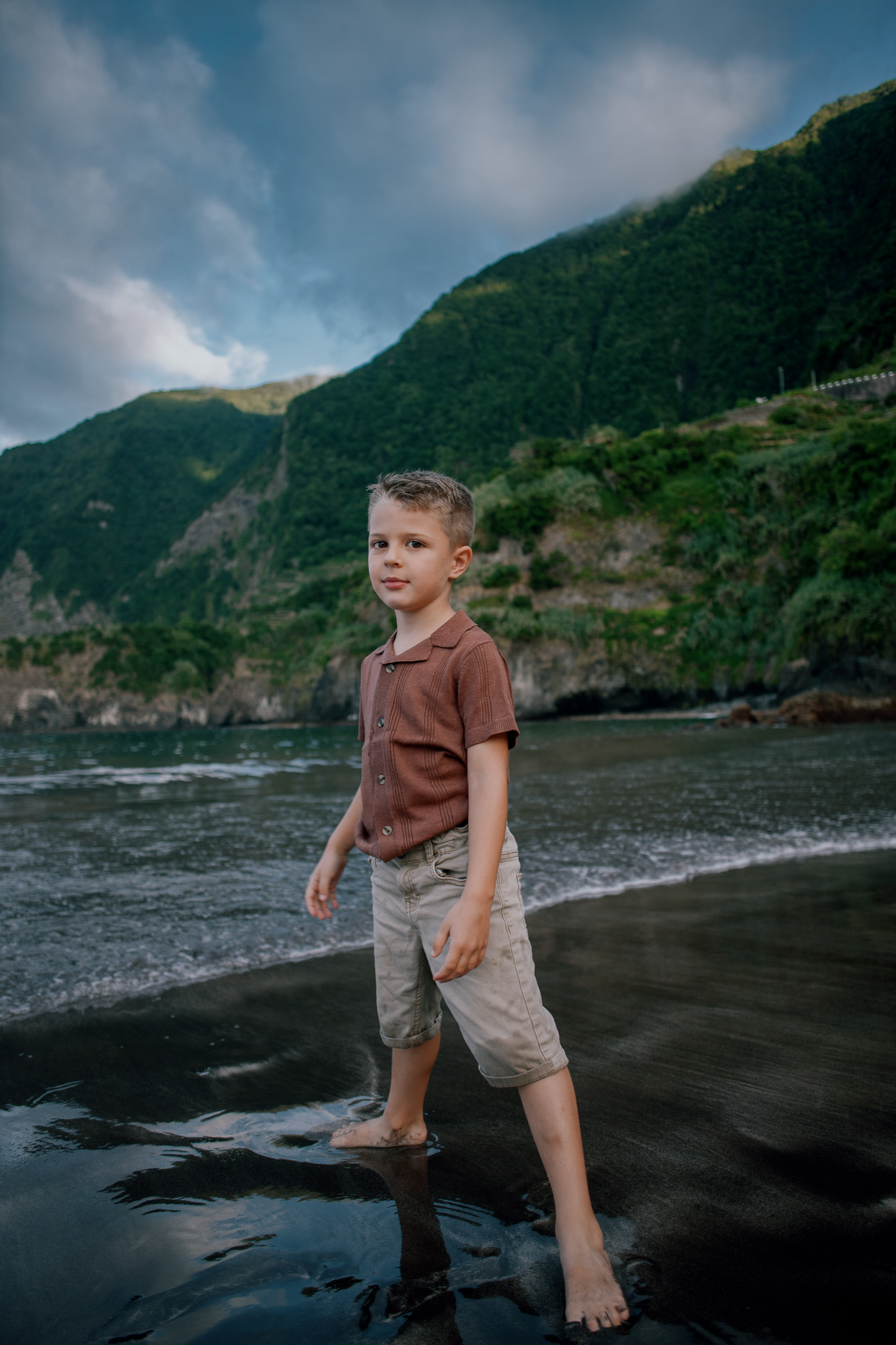 The little boy marching through the dark shallows, Seixal Beach, Madeira