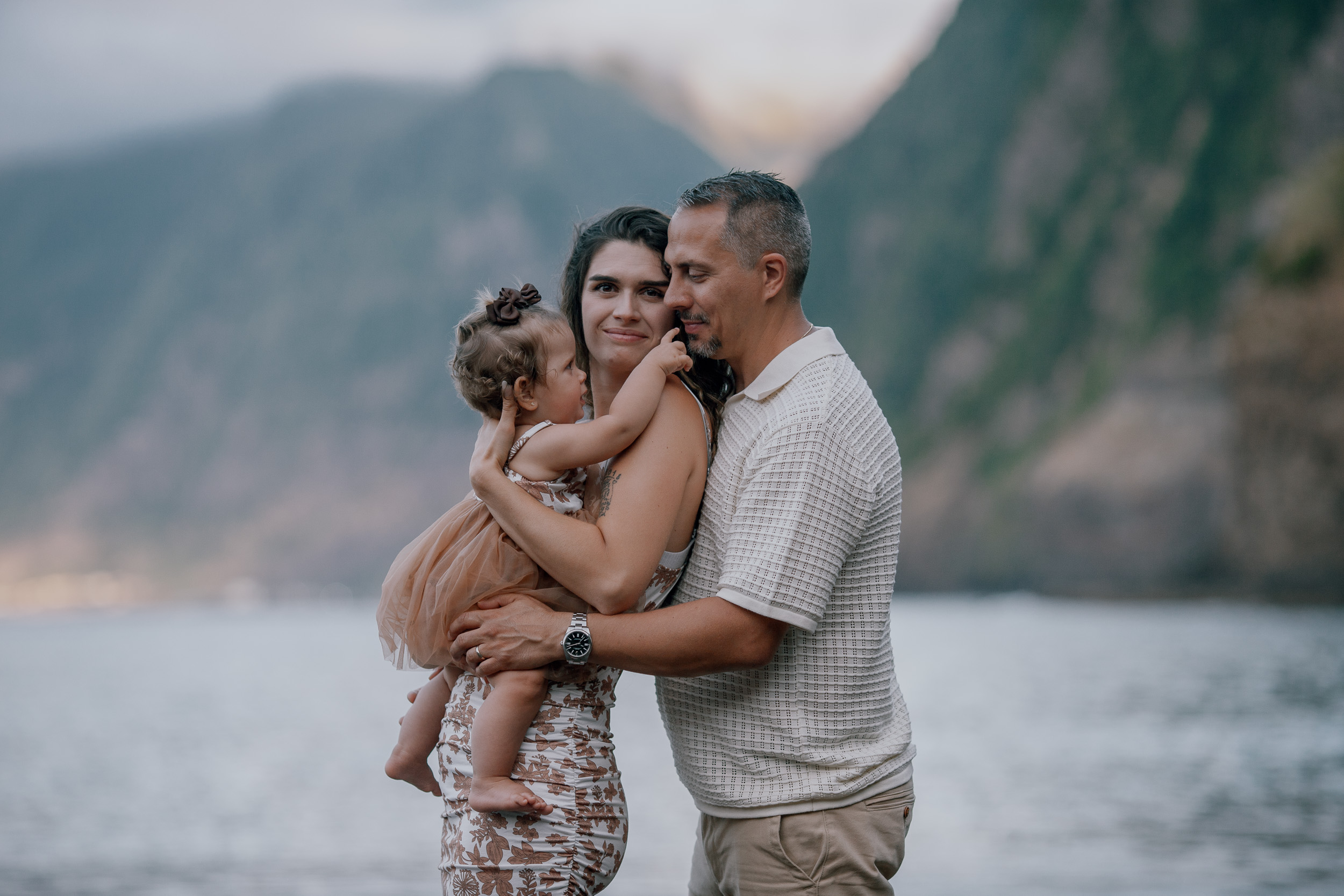 The family gathered at the waterline at nightfall, Seixal Beach, Madeira