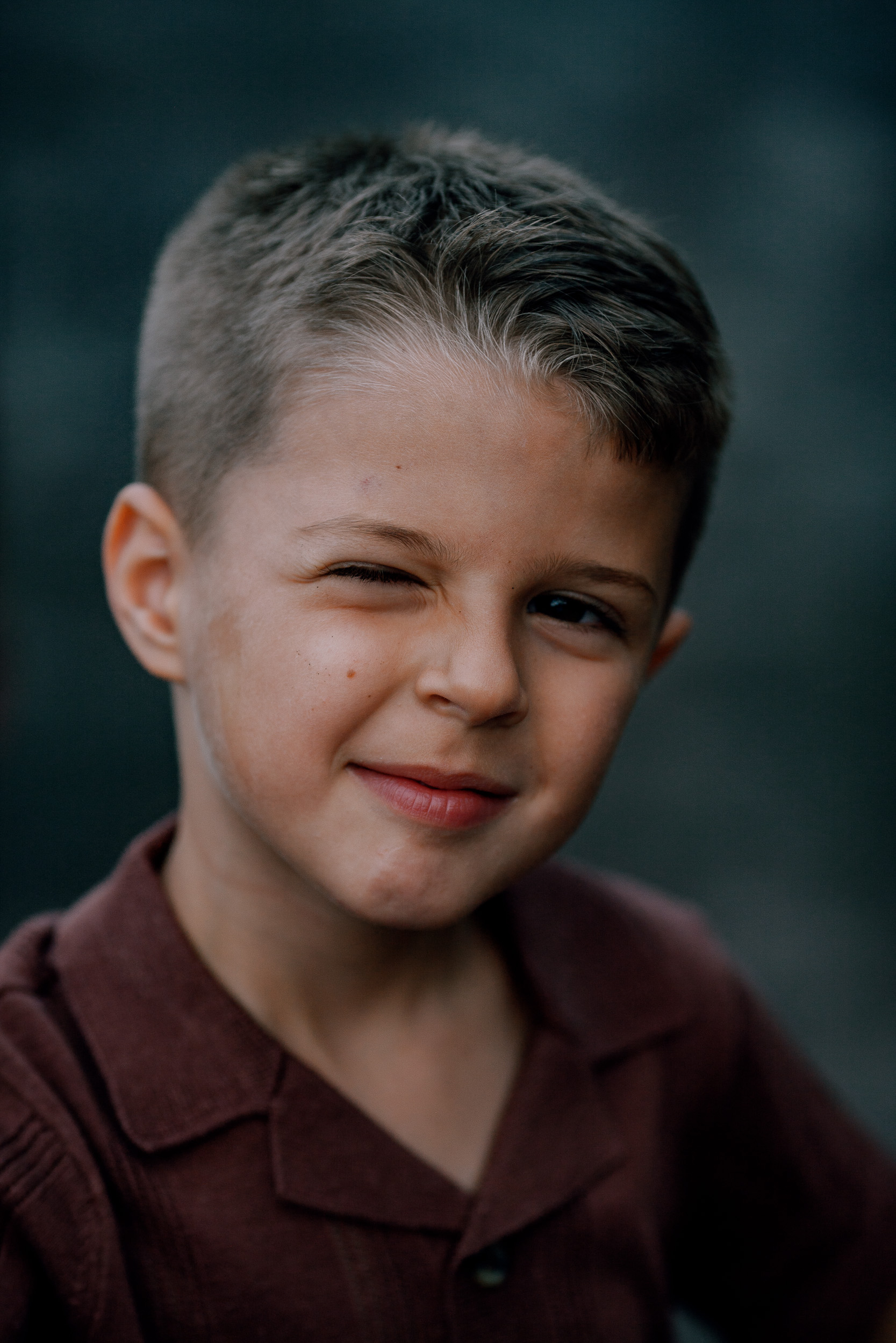 The boy winking at the camera in the dusk light, Seixal, Madeira