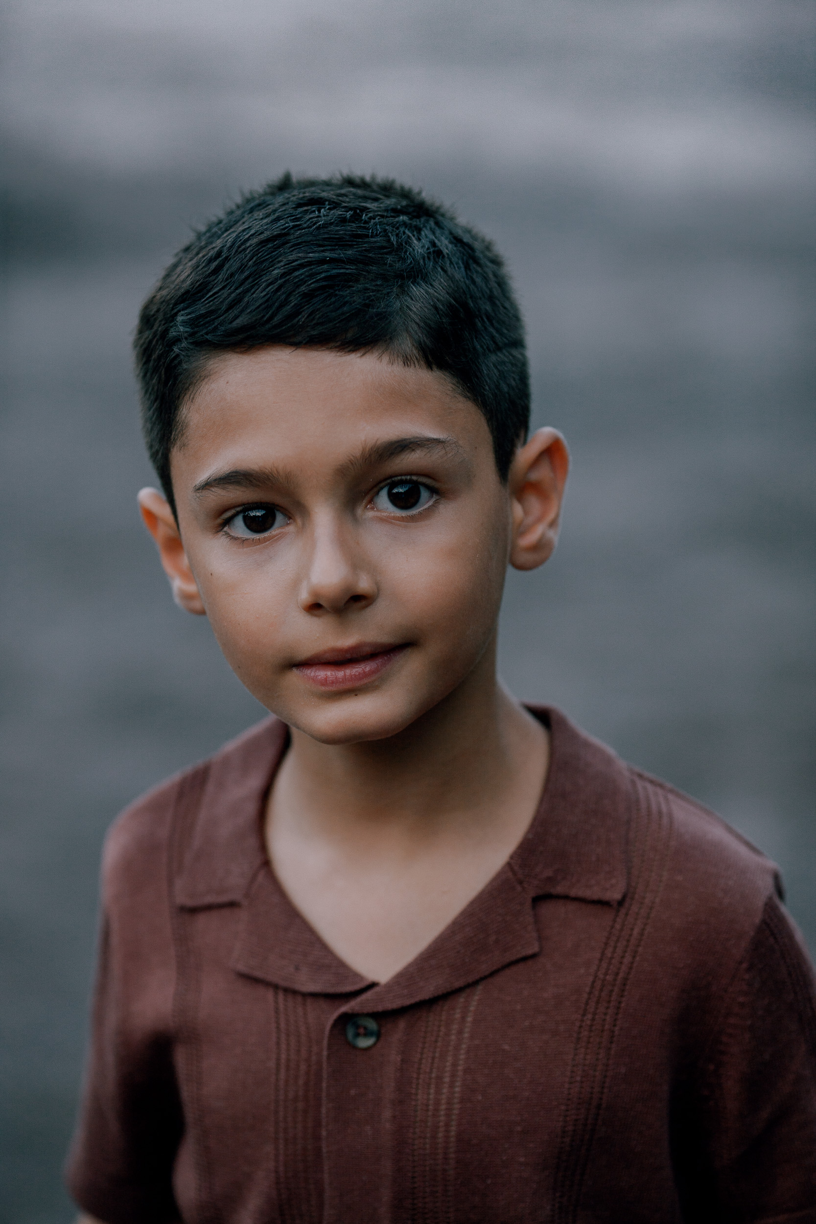 The older boy's calm portrait at dusk, Seixal Beach, Madeira