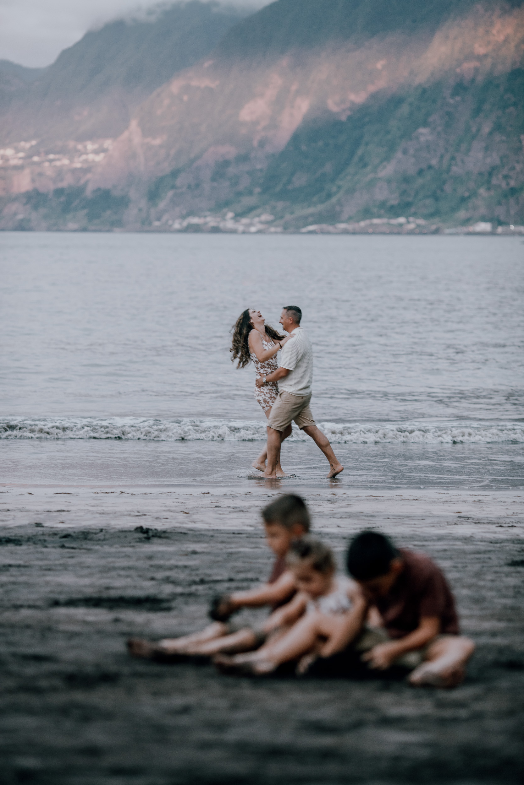 The parents dancing at the shore while the kids play, Seixal, Madeira