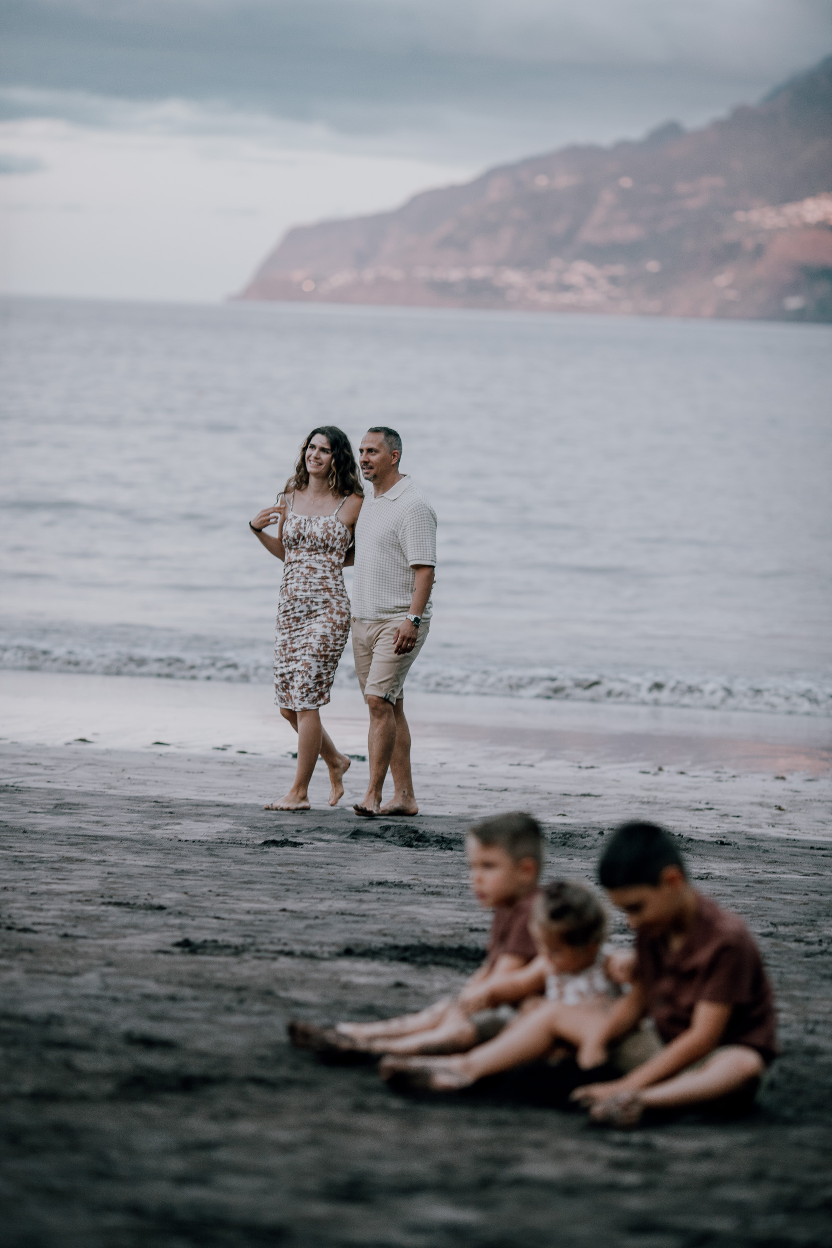The parents strolling behind the children at dusk, Seixal, Madeira