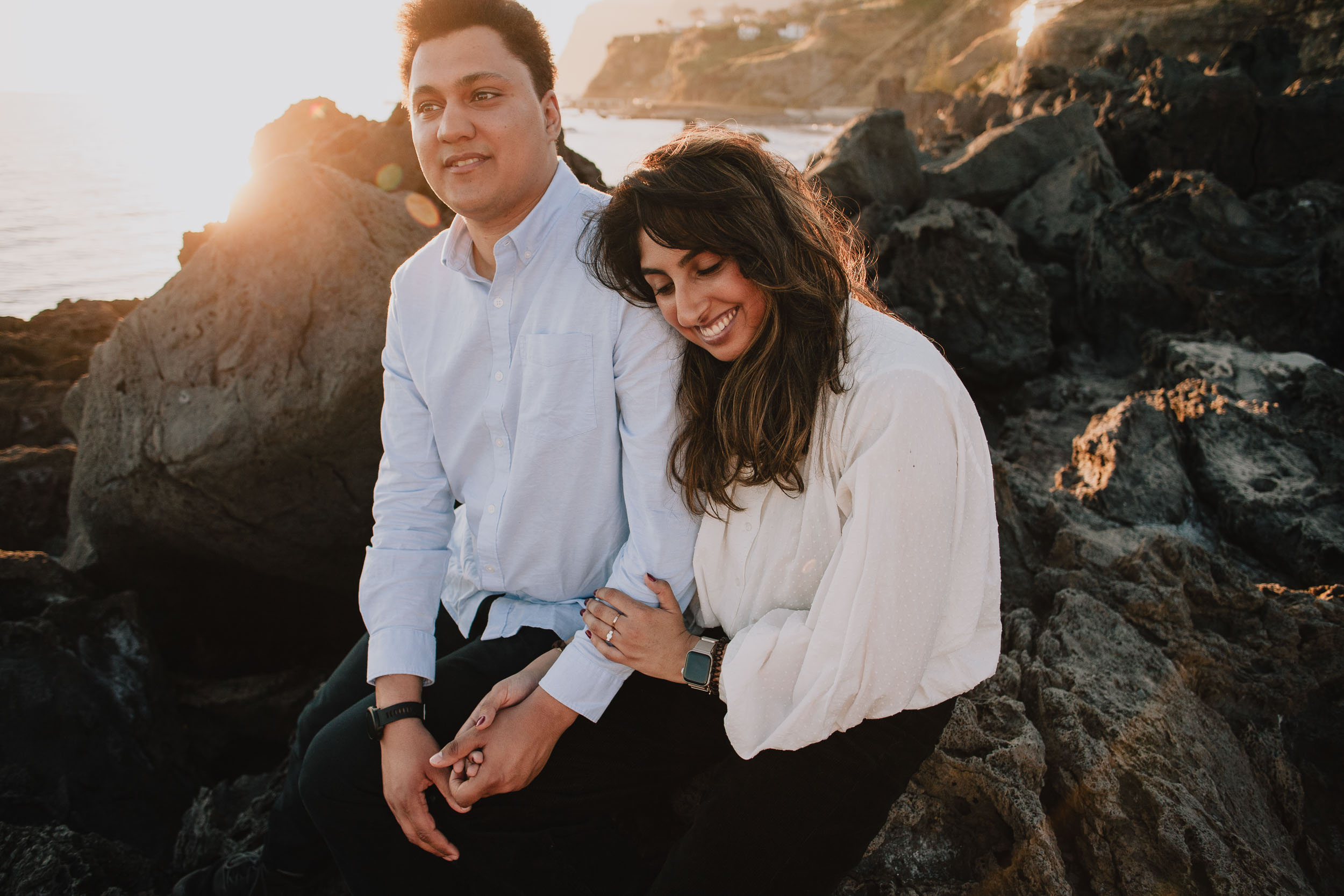 Couple in cream and pale blue at Praia Formosa, golden hour, Madeira