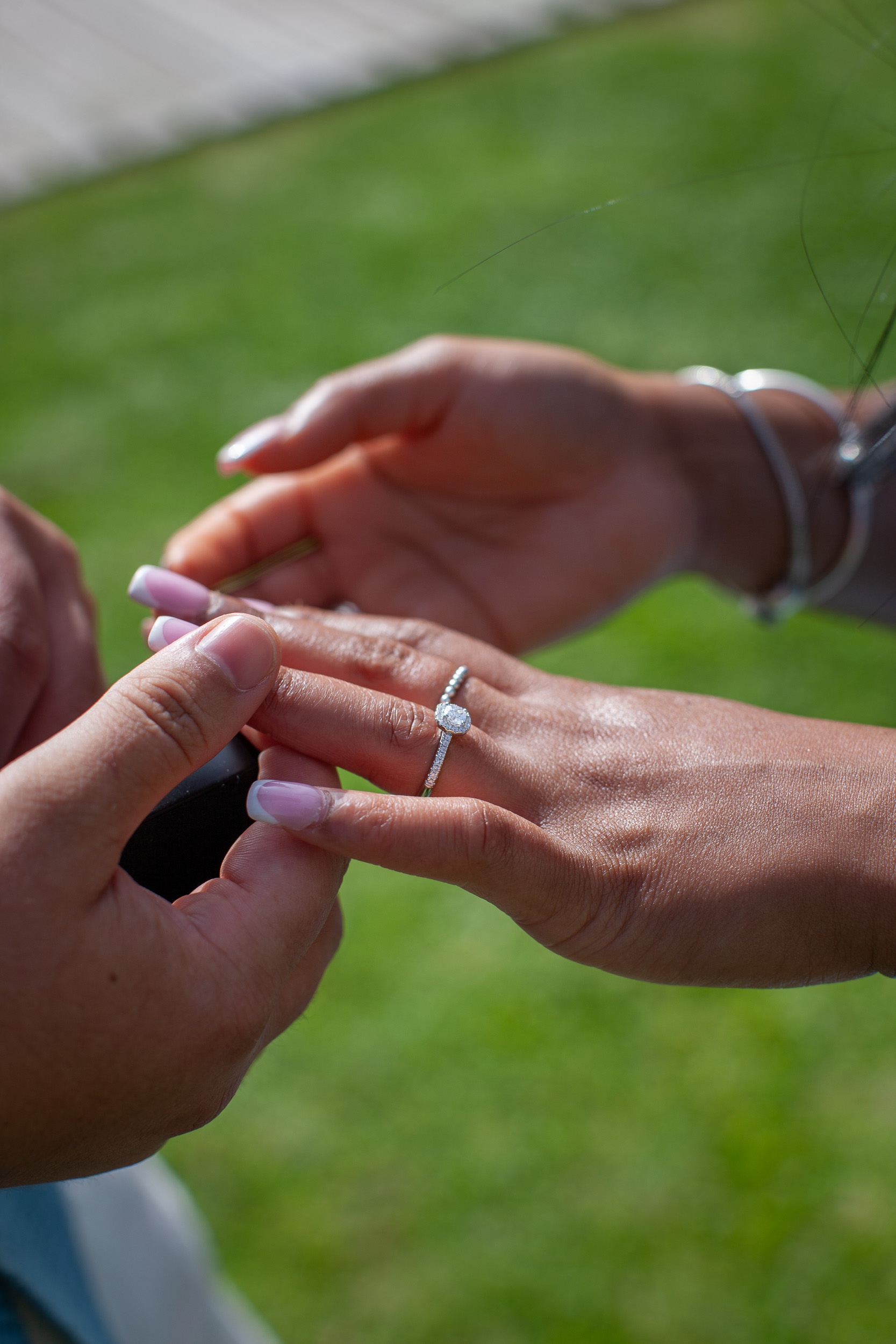Her manicured hand receiving the engagement ring, Funchal, Madeira