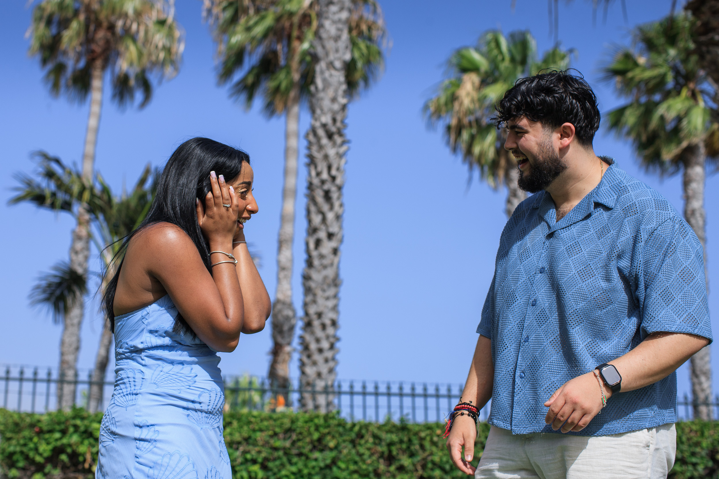 Hands on her cheeks in disbelief right after saying yes, palms behind, Madeira