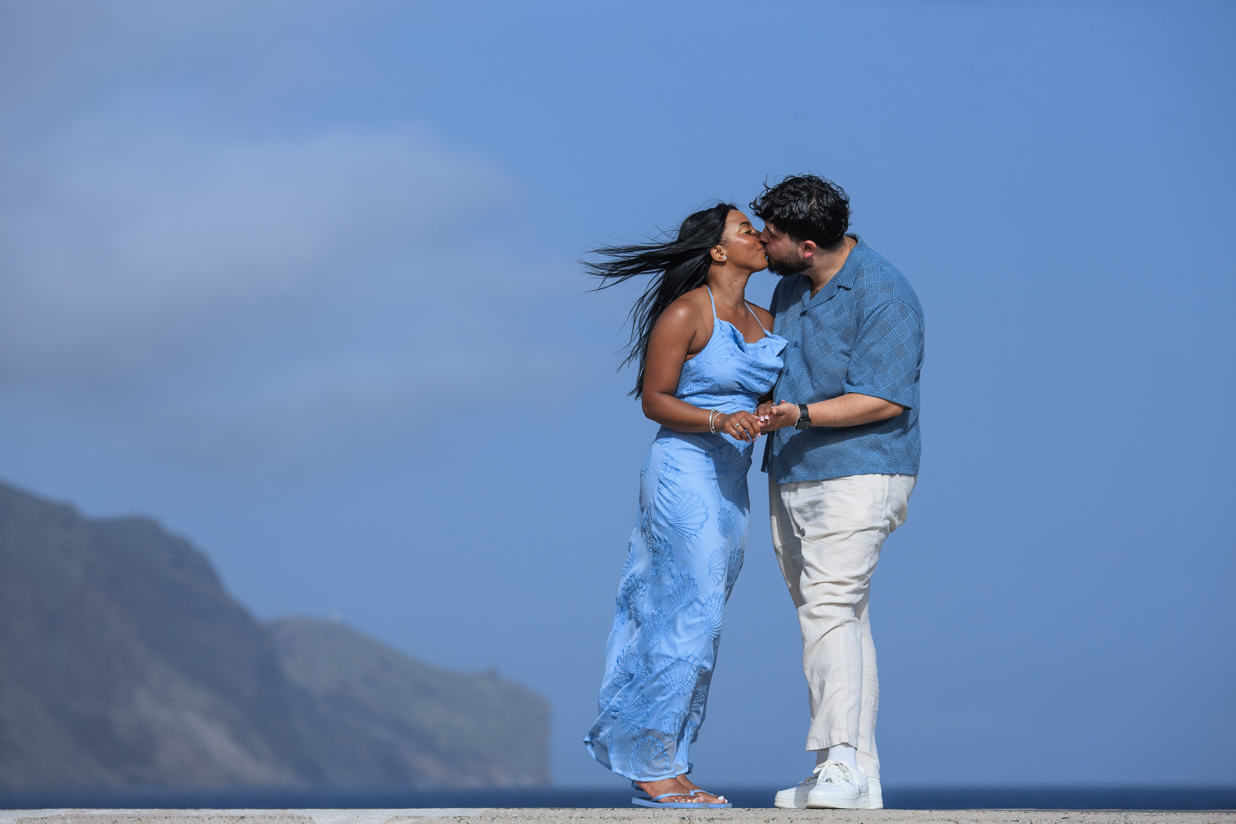A kiss above the ocean with the wind in her hair, Funchal seafront, Madeira