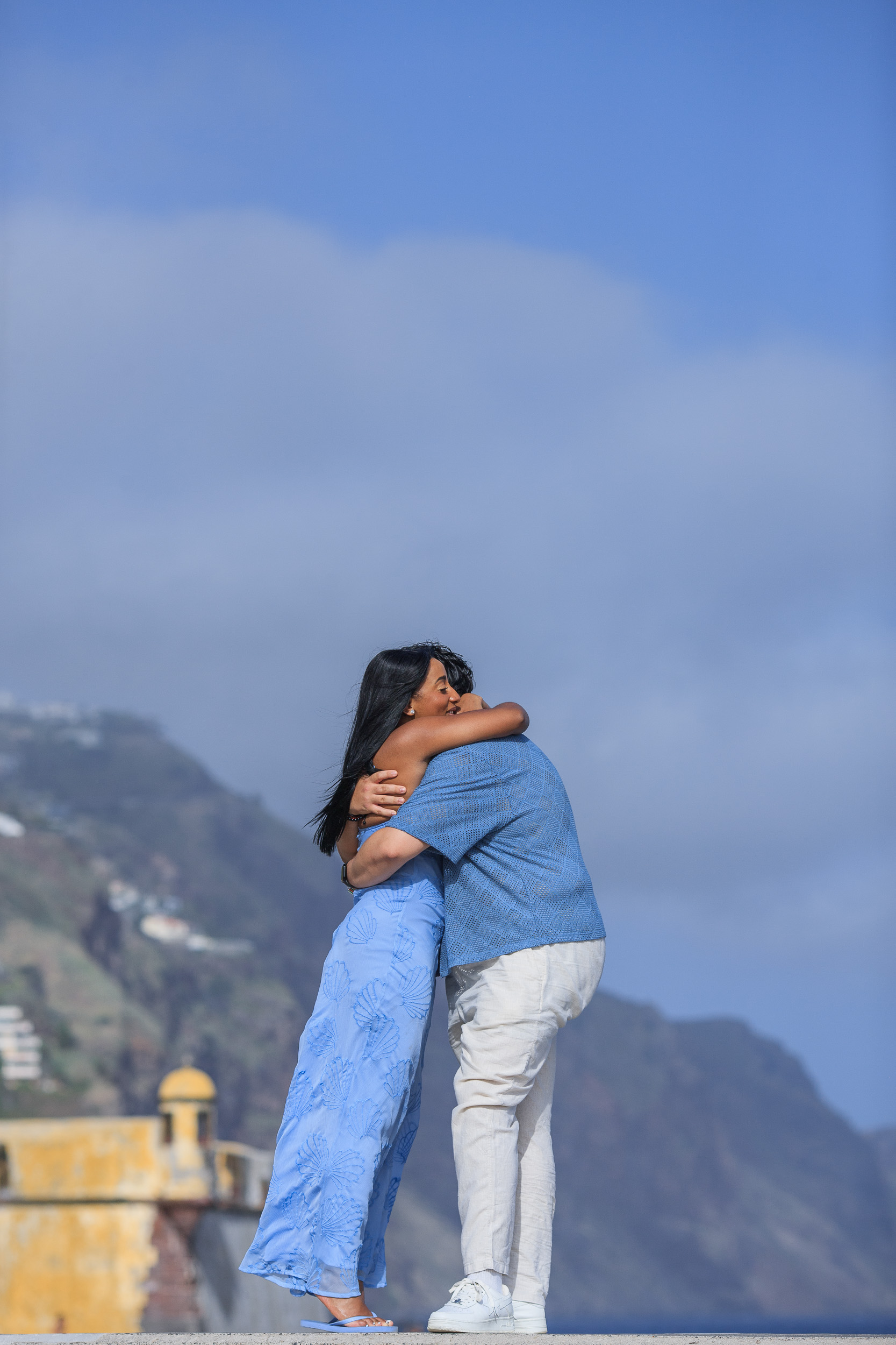A long hug on the fort terrace, engaged couple in Funchal, Madeira