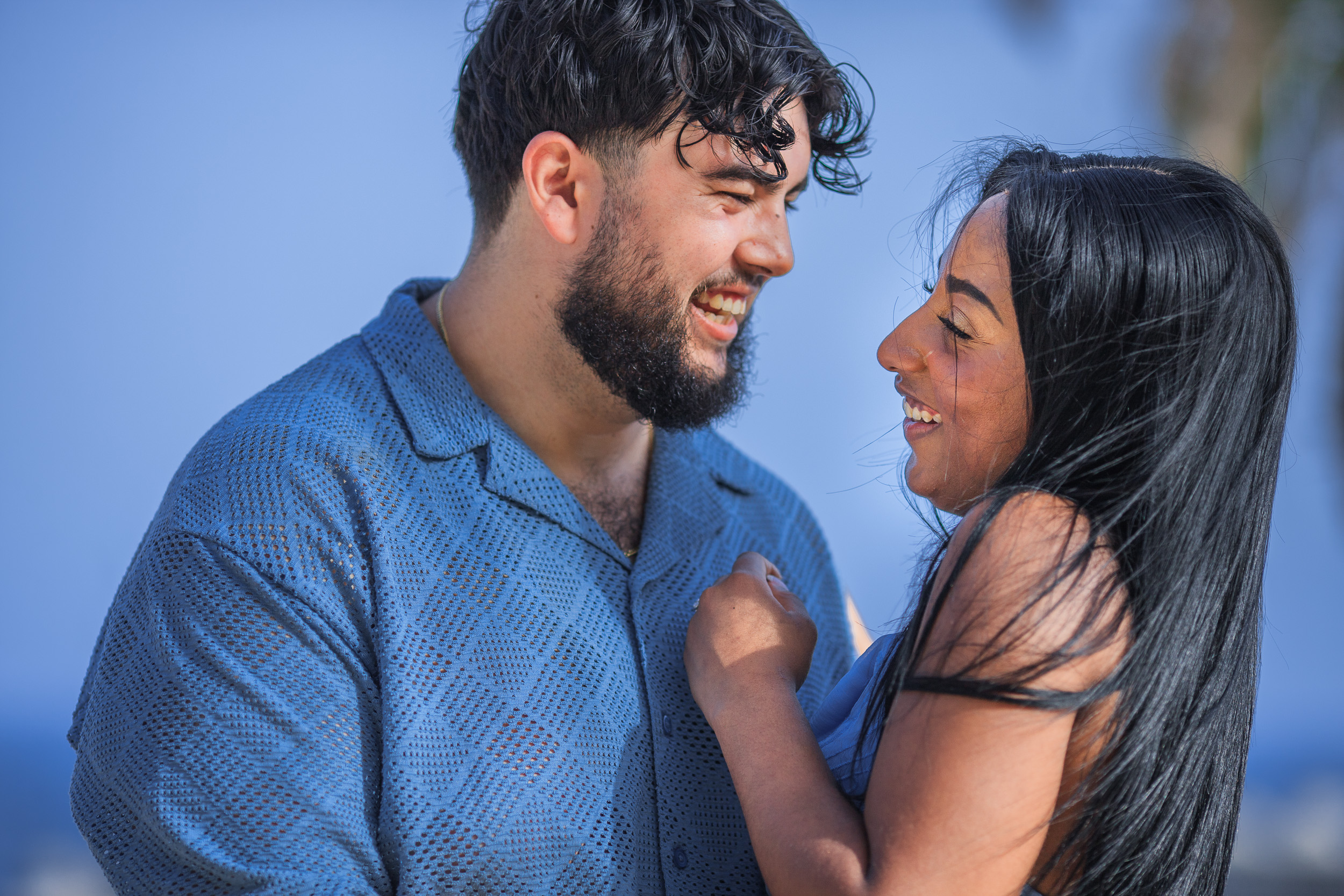 He makes her laugh nose to nose by the palms, engagement session in Funchal, Madeira