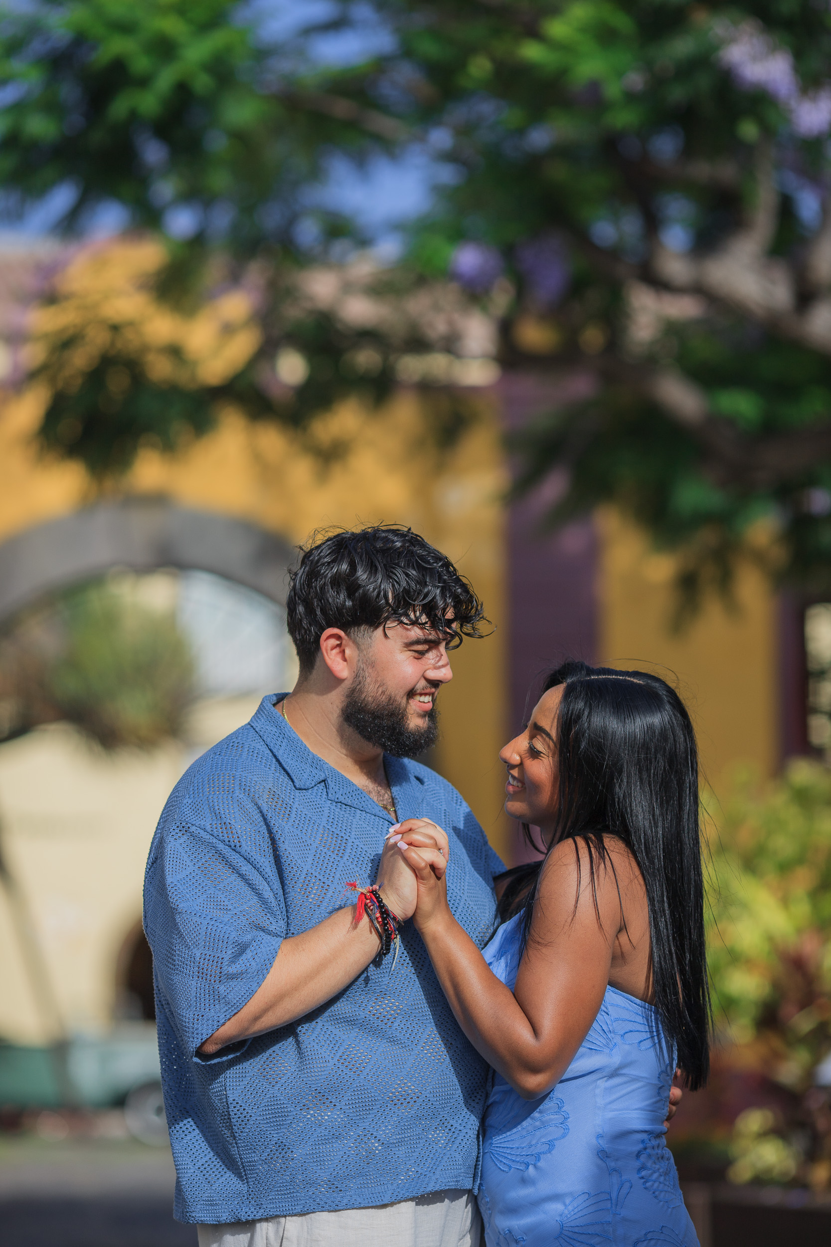 Dancing close in front of the yellow fort walls, engagement in Funchal old town, Madeira