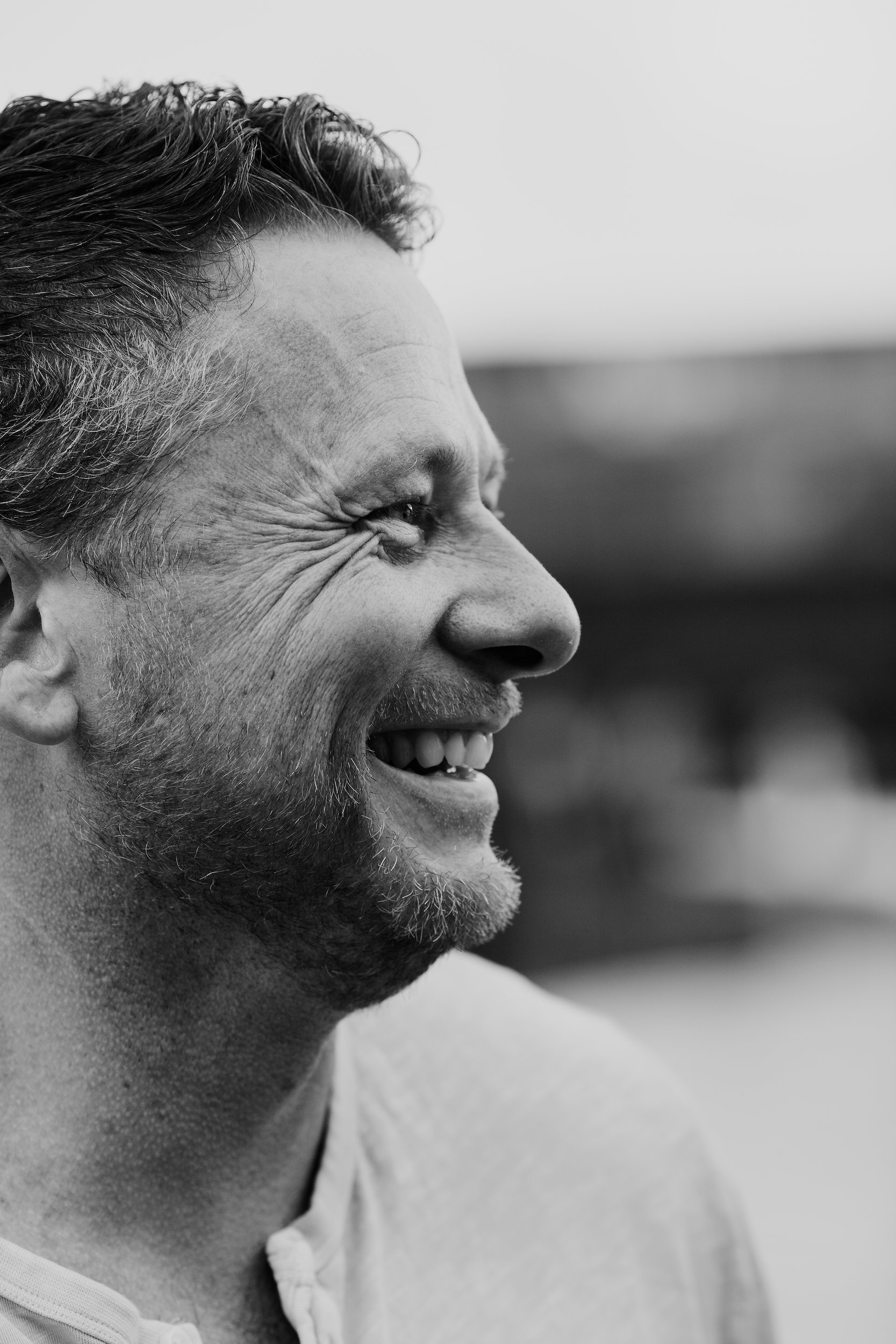 Black and white profile of the father laughing, Seixal Beach, Madeira