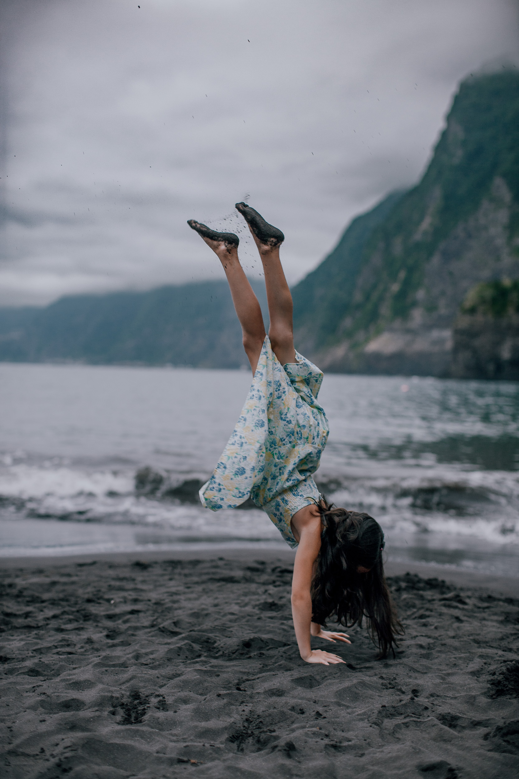 The younger daughter doing a handstand on the black sand, Seixal, Madeira