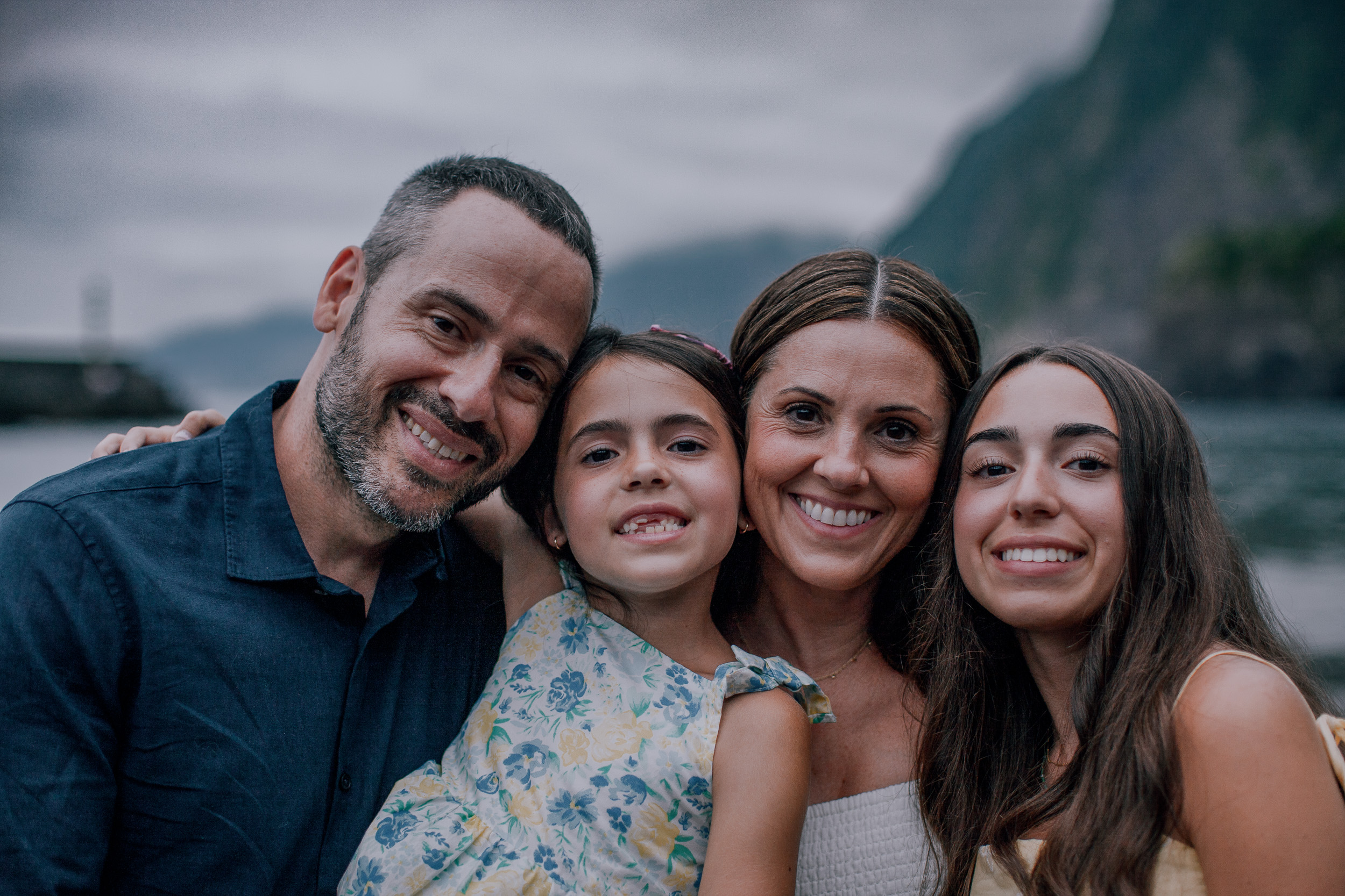 The four of them cheek to cheek grinning at the camera, Seixal, Madeira
