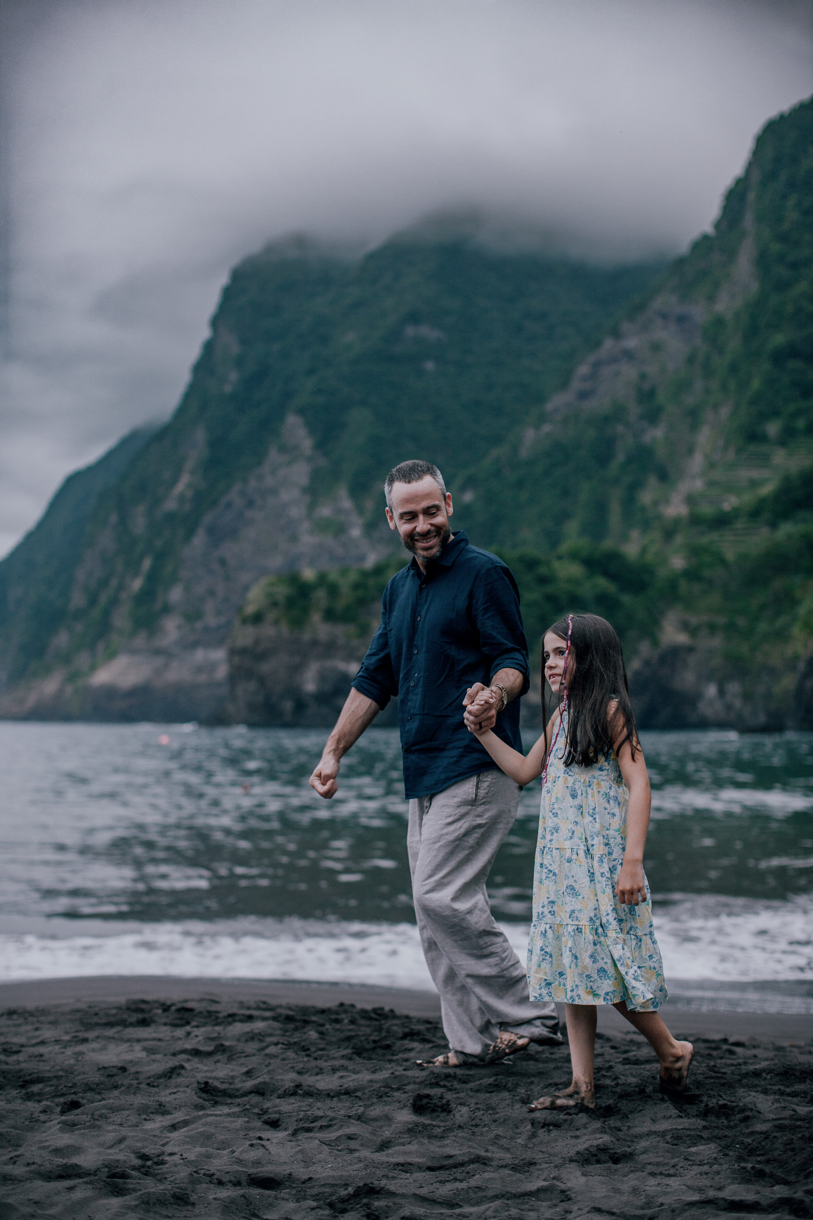Dad dancing with the younger daughter on the wet sand, Seixal, Madeira