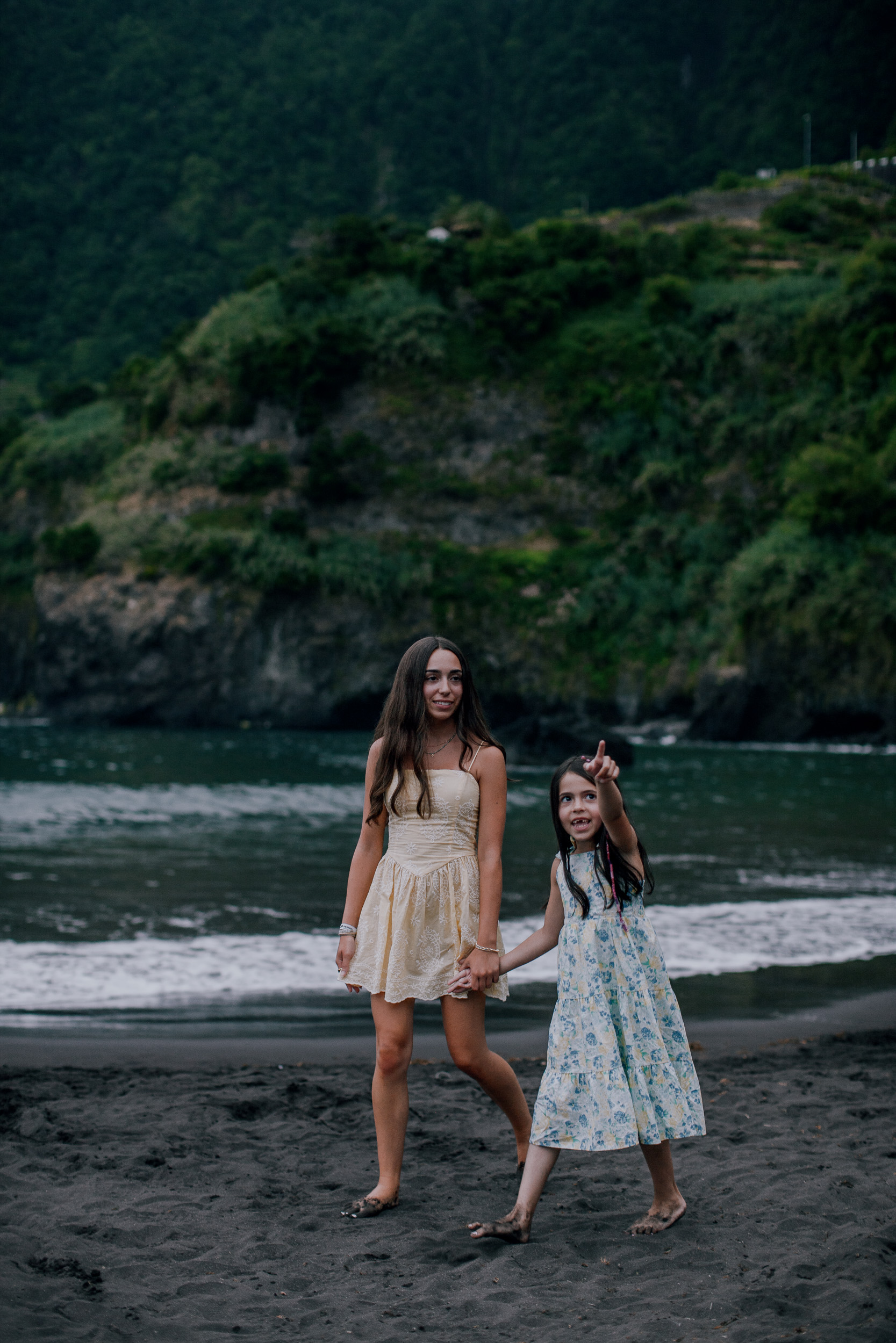 The two sisters together at the shore in evening light, Seixal, Madeira