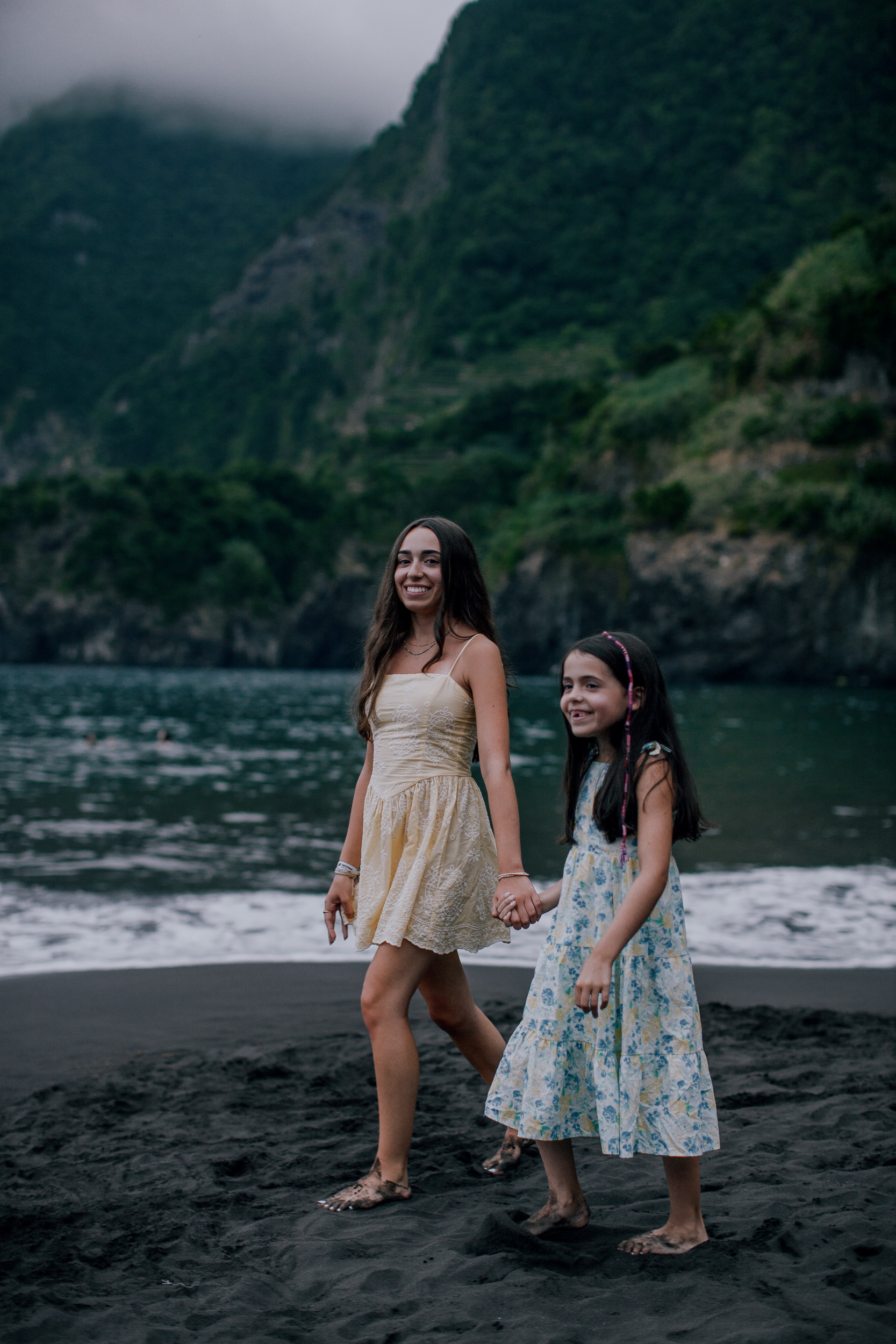 Mother walking the sand with the younger daughter, Seixal, Madeira